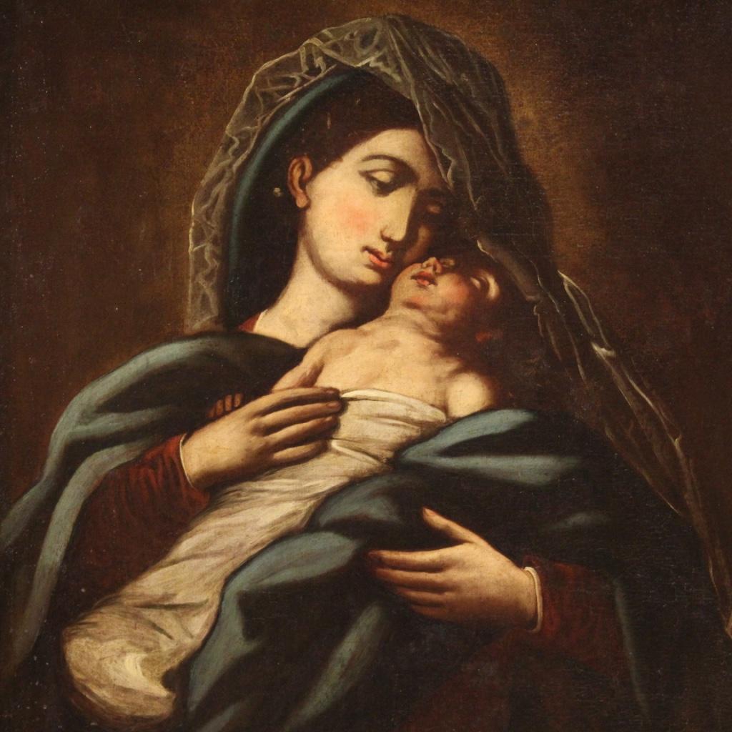 Antique Italian painting from the first half of the 18th century. Oil on canvas framework depicting a subject of sacred art Virgin with child of good pictorial quality. Painting that has undergone, towards the end of the 20th century, a conservative