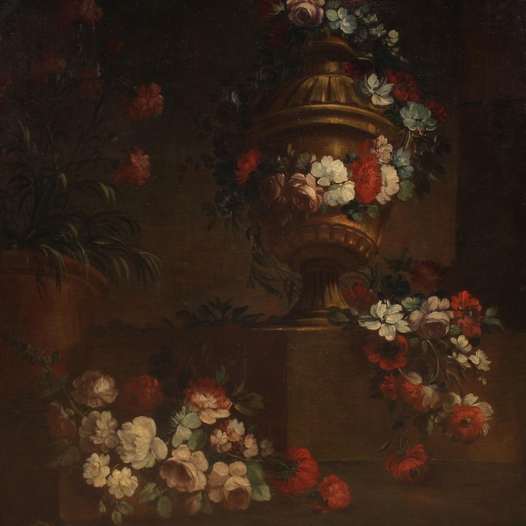 Great Italian painting from the first half of the 18th century. Oil artwork on canvas depicting a large still life with flowers of excellent pictorial quality. Painting that develops vertically characterized by a dark background that creates a
