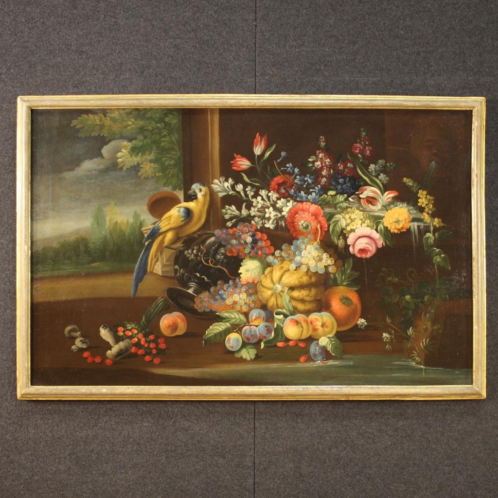 Antique Italian painting from the late 18th century. Framework oil on canvas depicting still life with parrot, flowers and fruit of good pictorial quality. Painting rich in decorative elements with landscape in the background on the left. 19th
