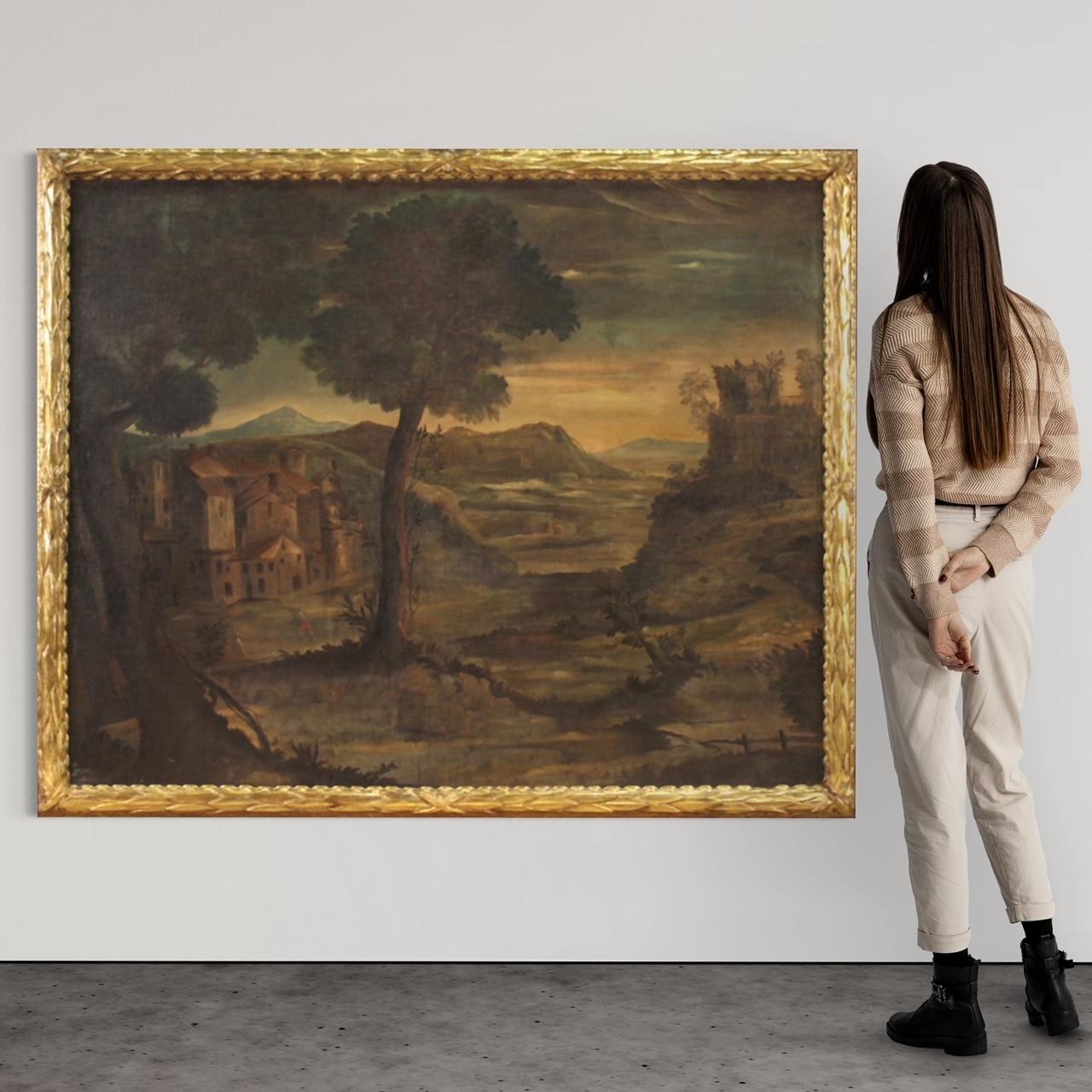 Gran paisaje italiano del siglo XVIII. Obra de arte al óleo sobre lienzo que representa un paisaje con arquitectura y agricultores de buena calidad pictórica. Cuadro adornado con un marco antiguo Luis XVI, tallado y dorado, de bella calidad y