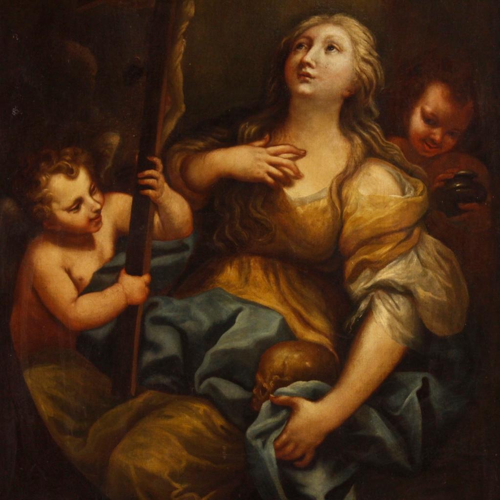 Antique Italian painting from early 18th century. Oil painting on canvas depicting Magdalene with crucifix and cherubs of excellent pictorial quality. Framework of Roman school for antique dealers and collectors, with carved and gilded wooden frame