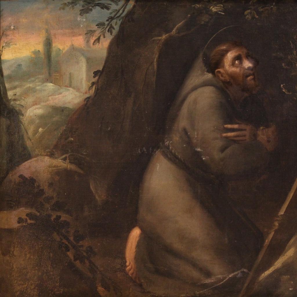 Peinture italienne ancienne de la première moitié du 18e siècle. Cadre en huile sur toile représentant un sujet religieux Saint François de bonne qualité picturale. Cadre en bois non Coeval, du 20ème siècle, sculpté et doré avec des signes de