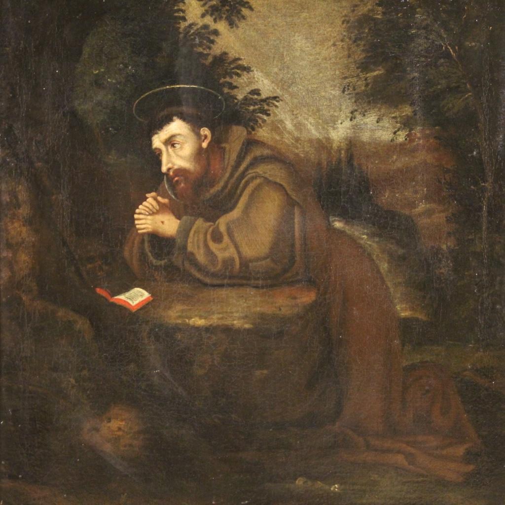 Ancient Italian painting from the first half of the 18th century. Framework oil on canvas depicting a religious subject Saint Francis of good pictorial quality. Modern wooden frame carved, lacquered and painted with relief decorations and half side