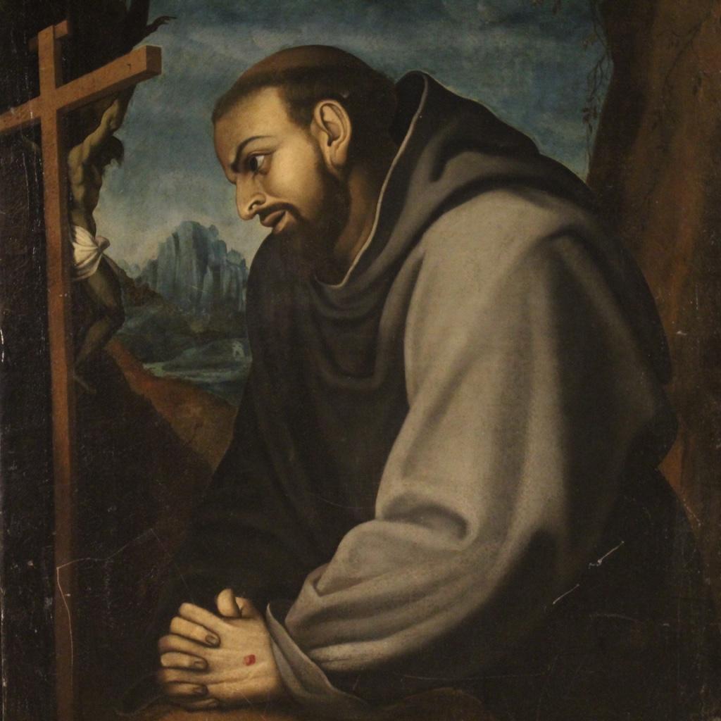 Italian painting from 18th century. Oil painting on canvas, already backed again, depicting a subject of sacred art, Saint Francis of good pictorial quality. Large impact painting, adorned with a landscape in the background and a wooden crucifix