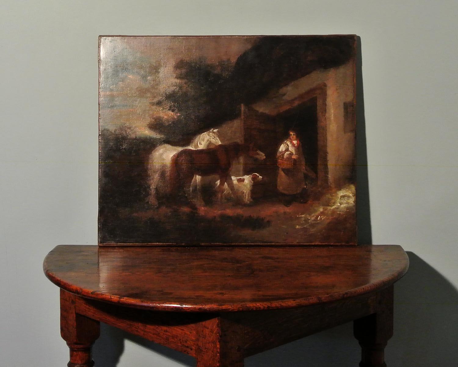 A fine 18th century oil on canvas which appears to depict 'The Bell Inn', frequently painted by George Morland in the late 1700s. The use of light, the color pallet and characteristic themes of dogs, horses and local people are also consistent with