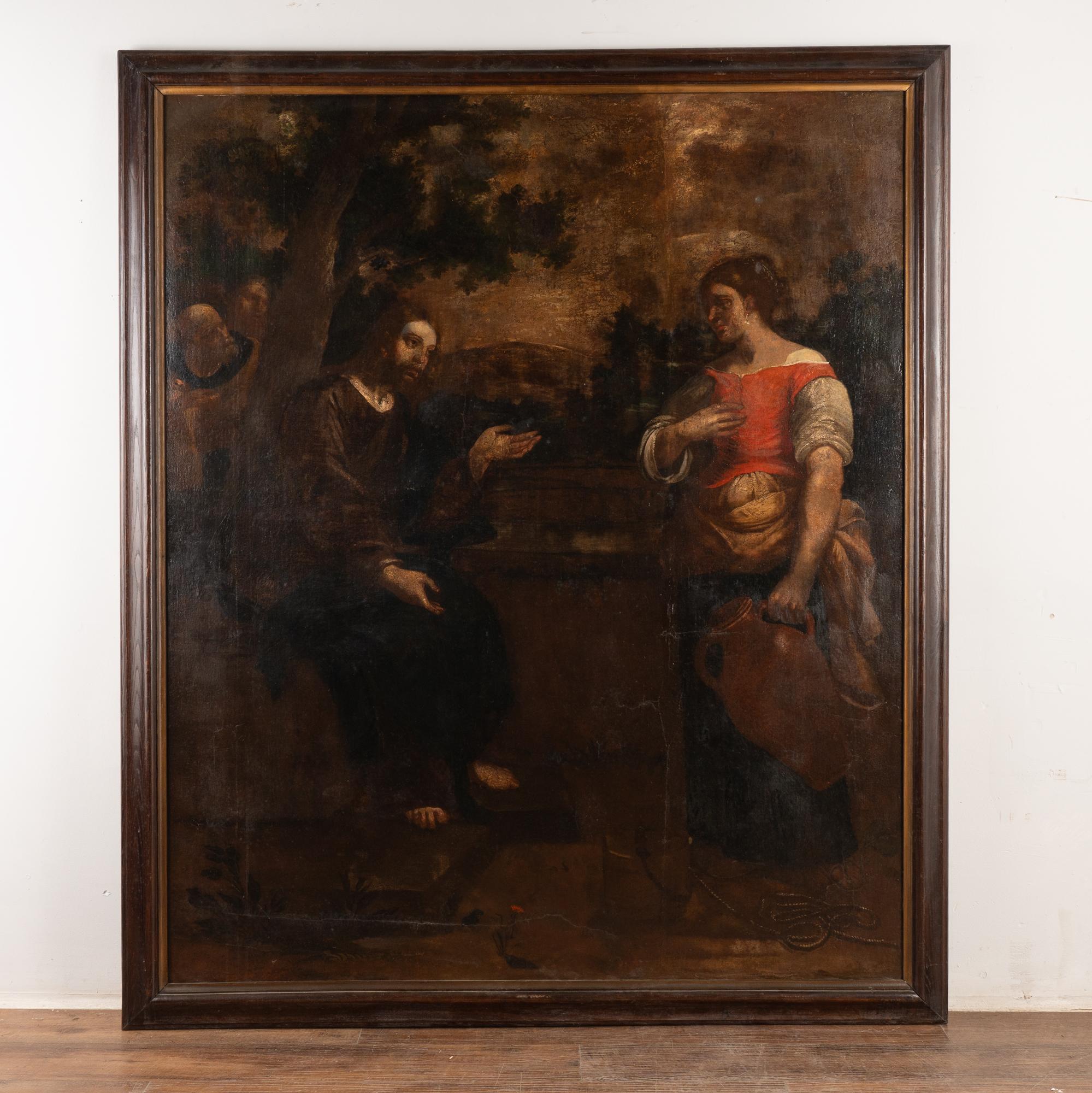 Large original oil on canvas painting of Christ and the Samaritan woman at the well (based on Biblical passage from John 4). Just under 7' tall with frame.
Has craquelure, retouches and old repairs throughout; including along left side and crack to