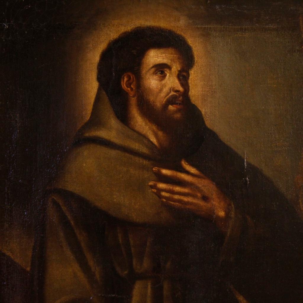 Antique 18th century Spanish painting. Oil painting on canvas depicting religious subject, representation of St. Francis with crucifix. Painting of excellent proportion and quality that has undergone a conservative restoration during 20th century.