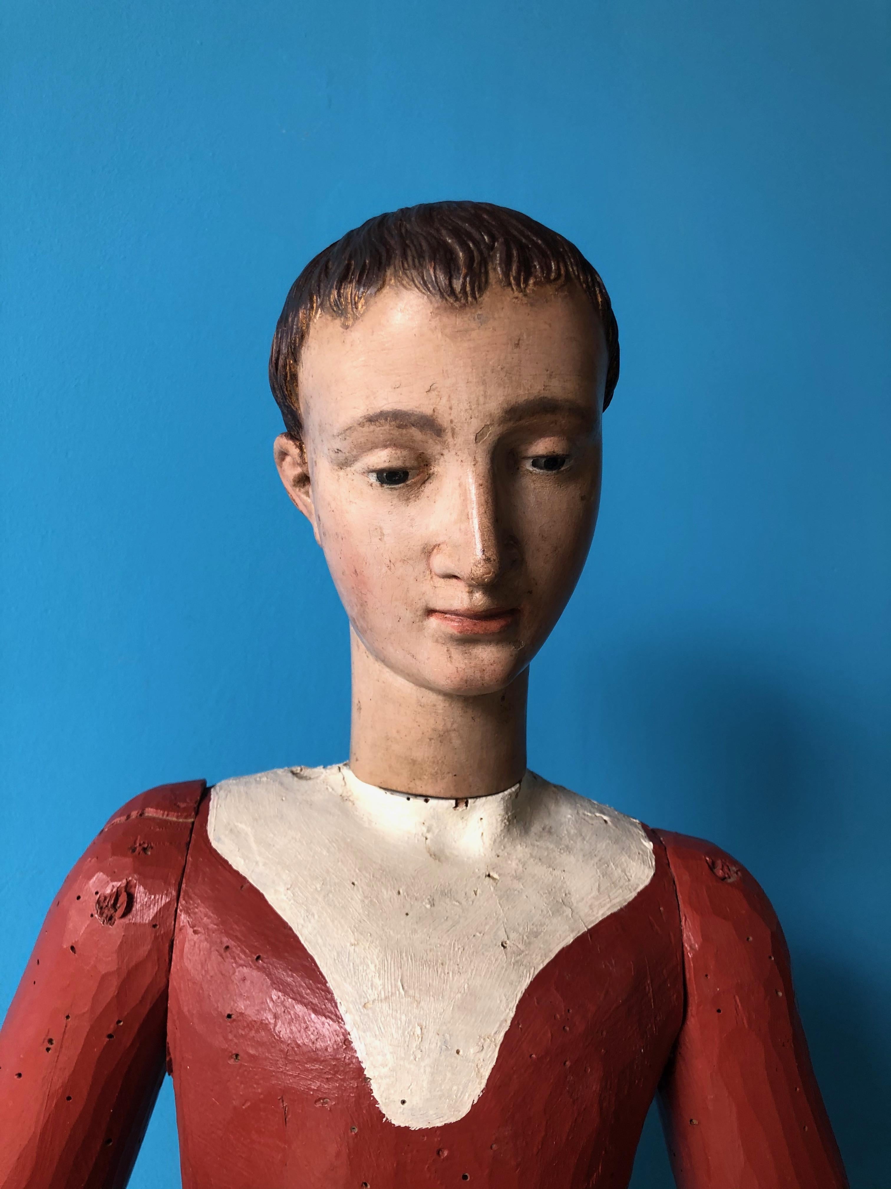 Youthful mannequin made of beech wood with original lacquer finish. Natural size, of Italian origin and realistically sculpted. The entire structure is well-proportioned, and of great quality. The face is truly a work of great cabinet-making, as the