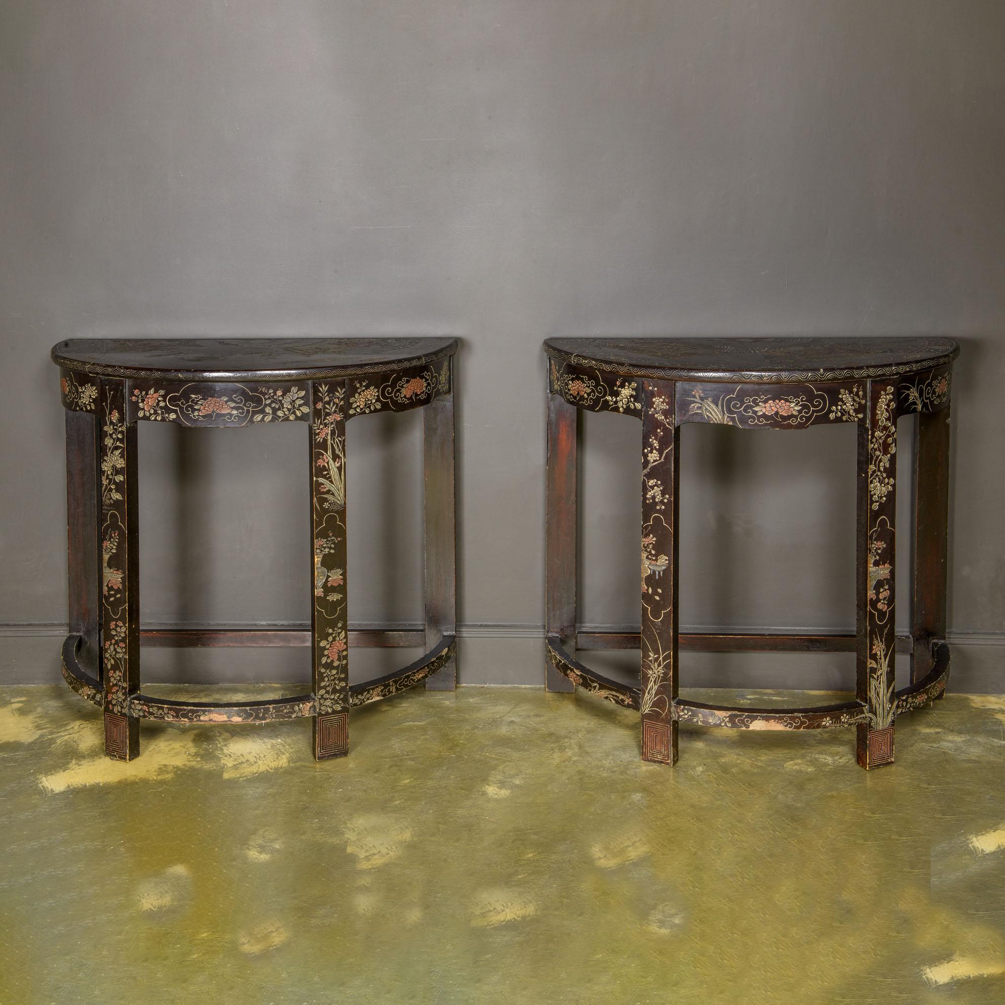 18th Century Orientalist Pair of Lacquered Consoles

Pair of wonderful demi-lune console tables in black lacquered wood.
 Entirely decorated with floral and geometric motifs.
On the floor are idealised landscapes with pagodas inhabited by characters