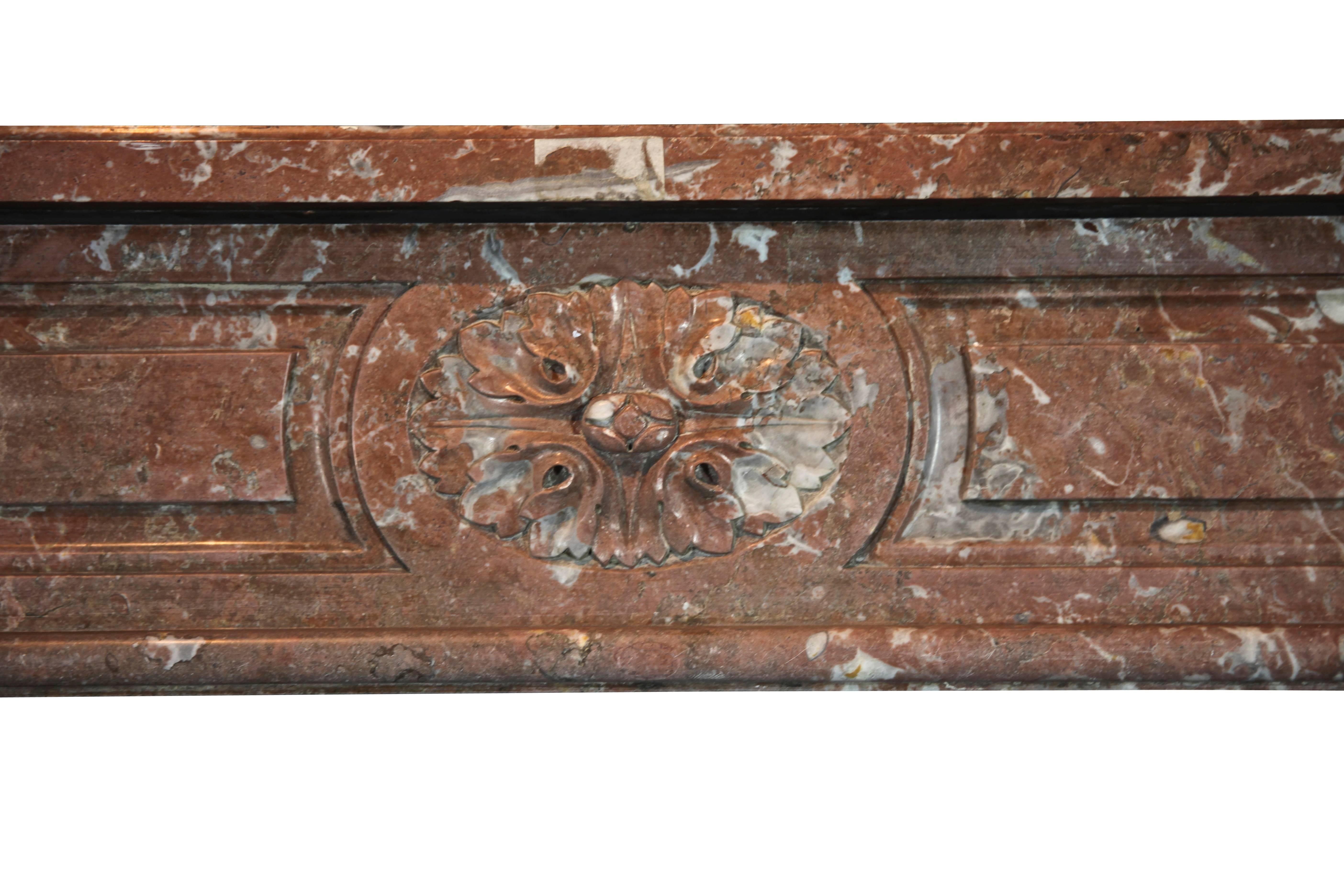 This antique Belgian fireplace surround is very graceful and has unusually wide proportions.
Perfect for a French interior deco with a wide firebox.

Measures: 
200 cm EW 78.74
