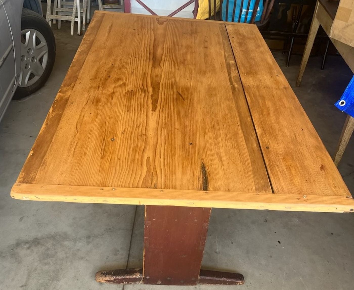This fantastic all original red painted lift top table with shoe feet and early rose head nails. All original hardware and construction. Take notice to the very narrow seat base. Such a great sweet size. This fantastic folky shaped table is strong