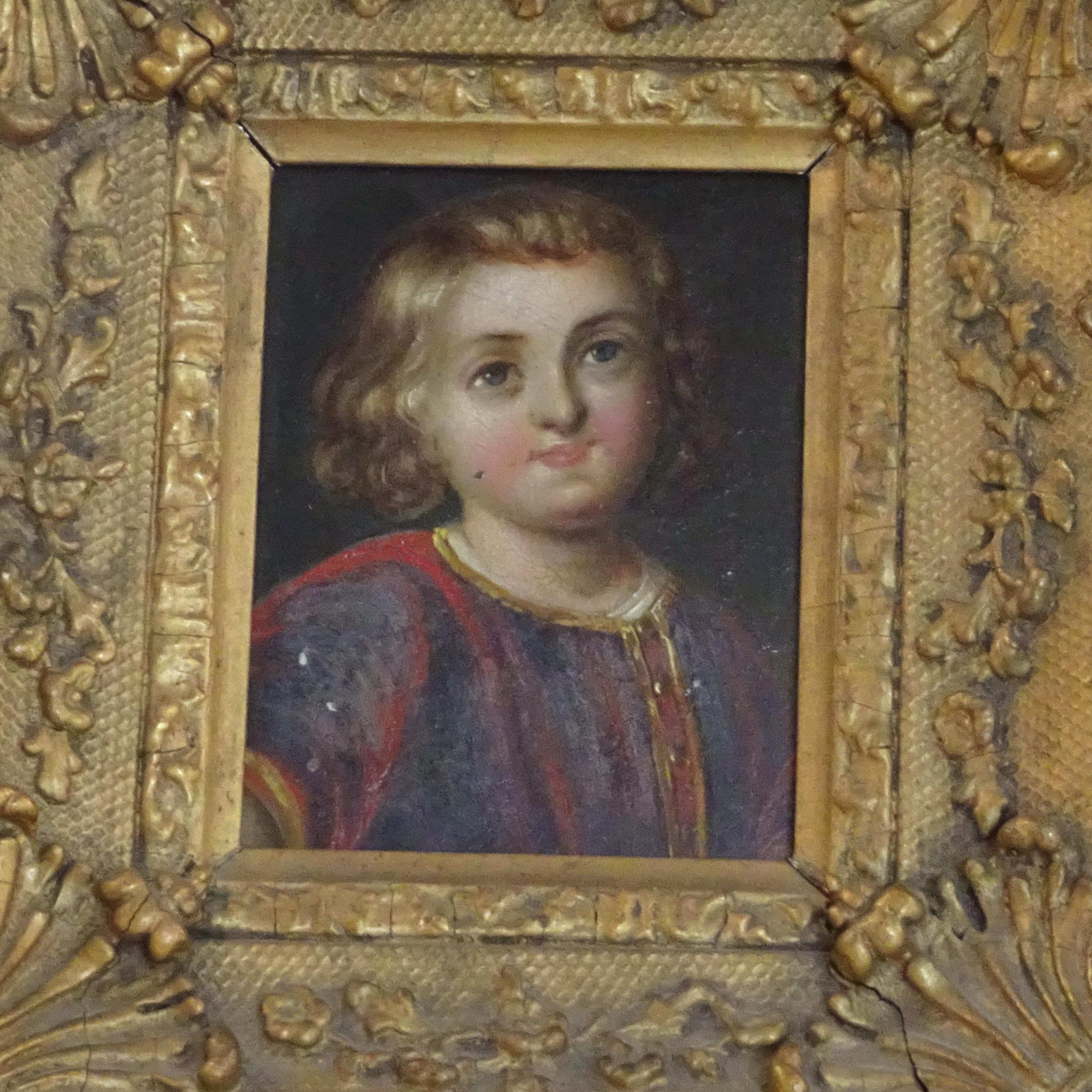 Portrait of young boy in red and black coat in ornate 18th century gold frame. Some pieces missing from the frame.