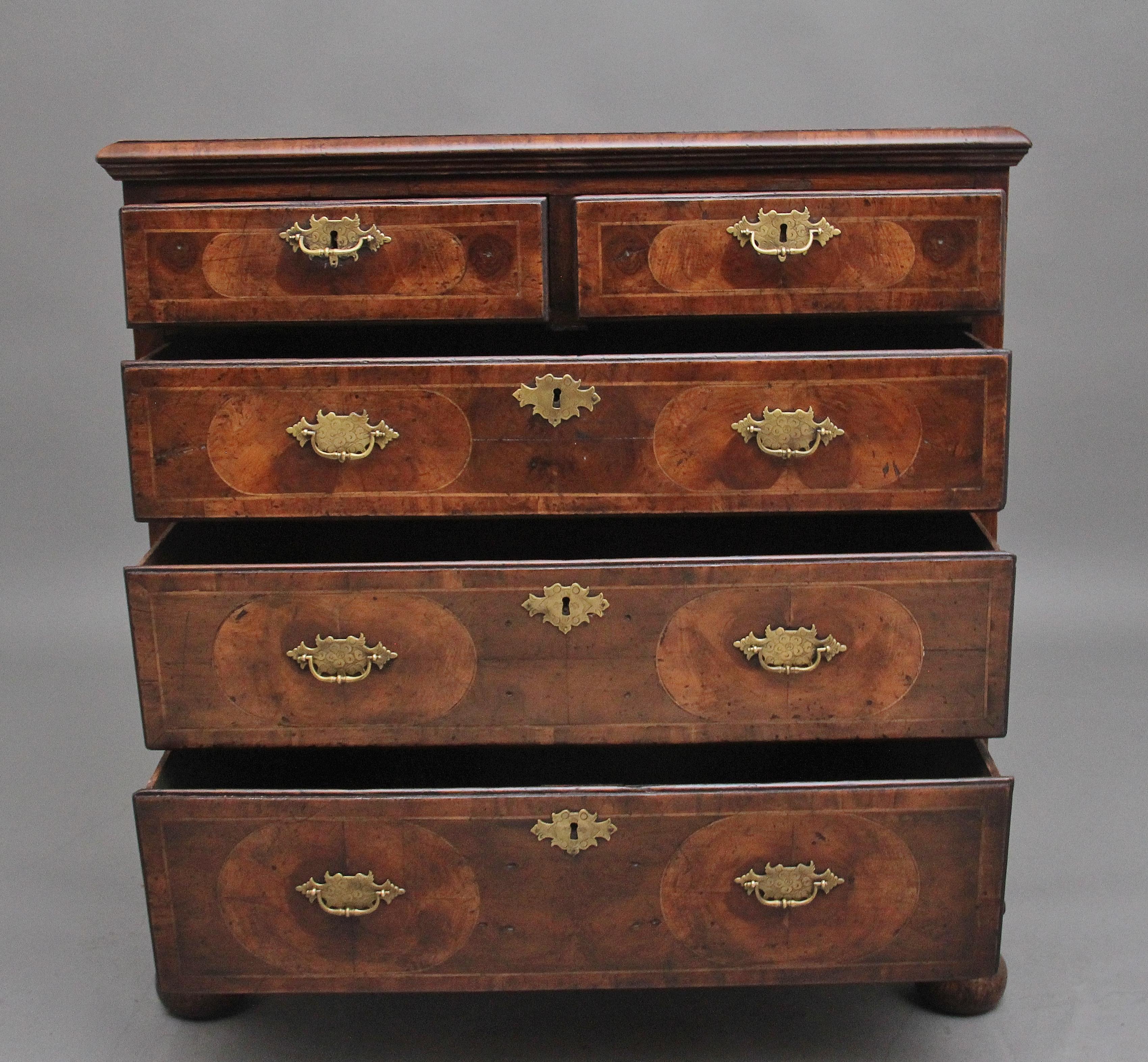 18th Century & later re-vernered oyster wood chest of drawers of good proportions, having a wonderful decorative oyster venered top with a cross grained thumb moulded edge above two short over three long graduated oak lined drawers, with shaped and