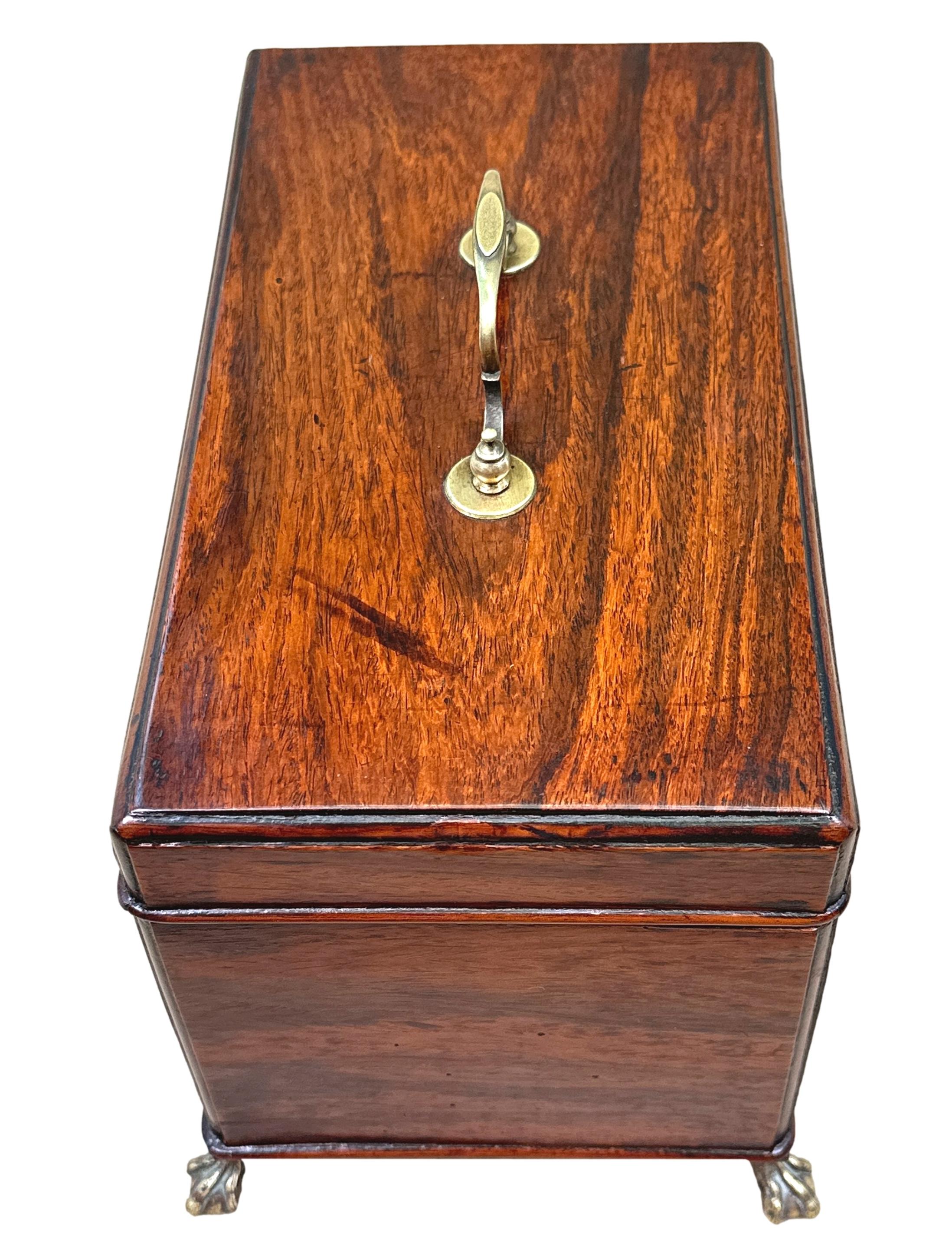 A Very Rare 18th Century Padouk Wood Rectangular Tea Caddy Of Rectangular Form, Having Original Brass Handle To Hinged Top Enclosing Divisions, Raised On Elegant Original Brass Claw And Ball Feet.


Padouk is a wood indigenous to both the East and