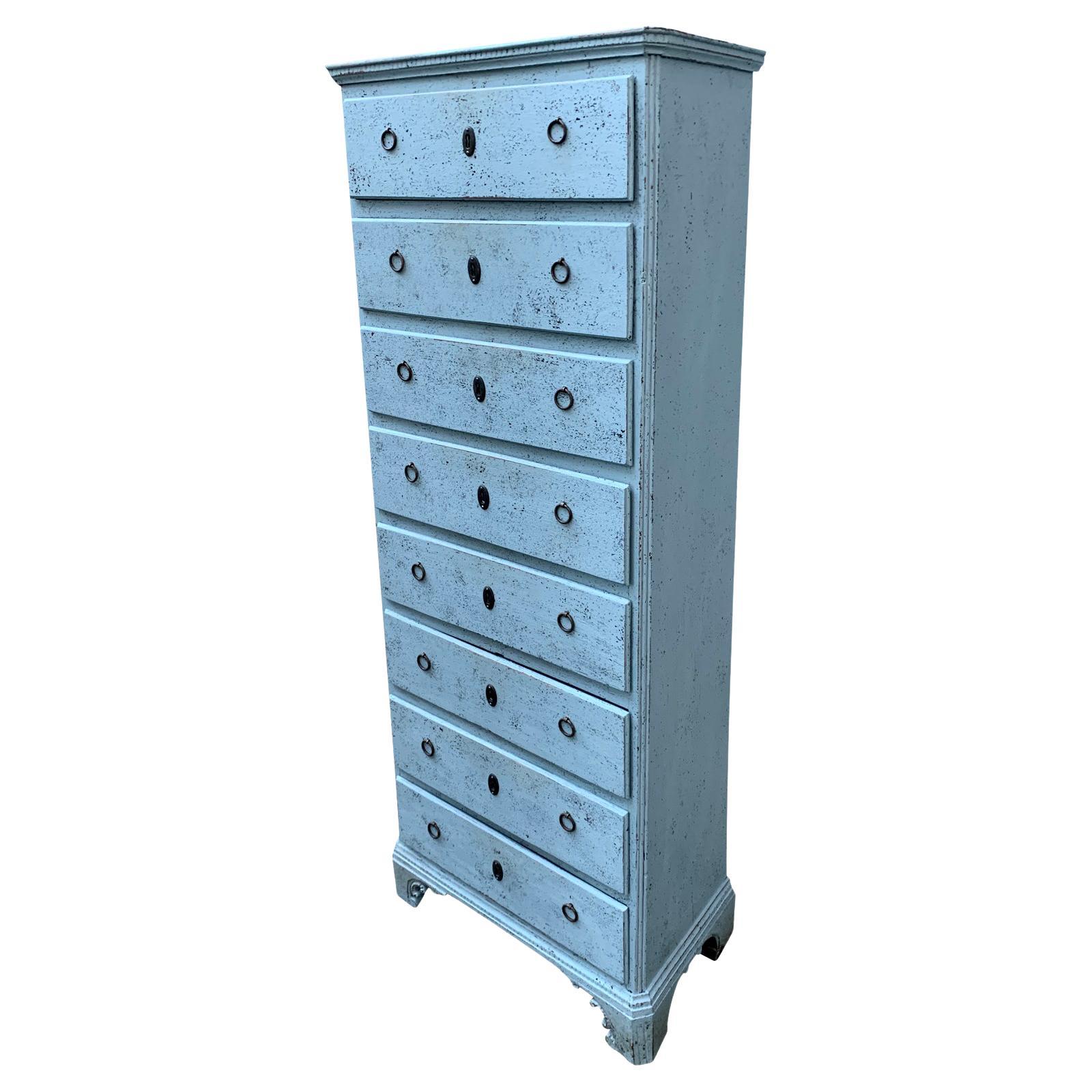 This 18th century antique chest of drawers or tallboy, painted in typical Gustavian light blue/grey color is from Danmark or Southern Sweden. 
This dresser comes with original working hardware, locks and key. All the drawers open with ease using