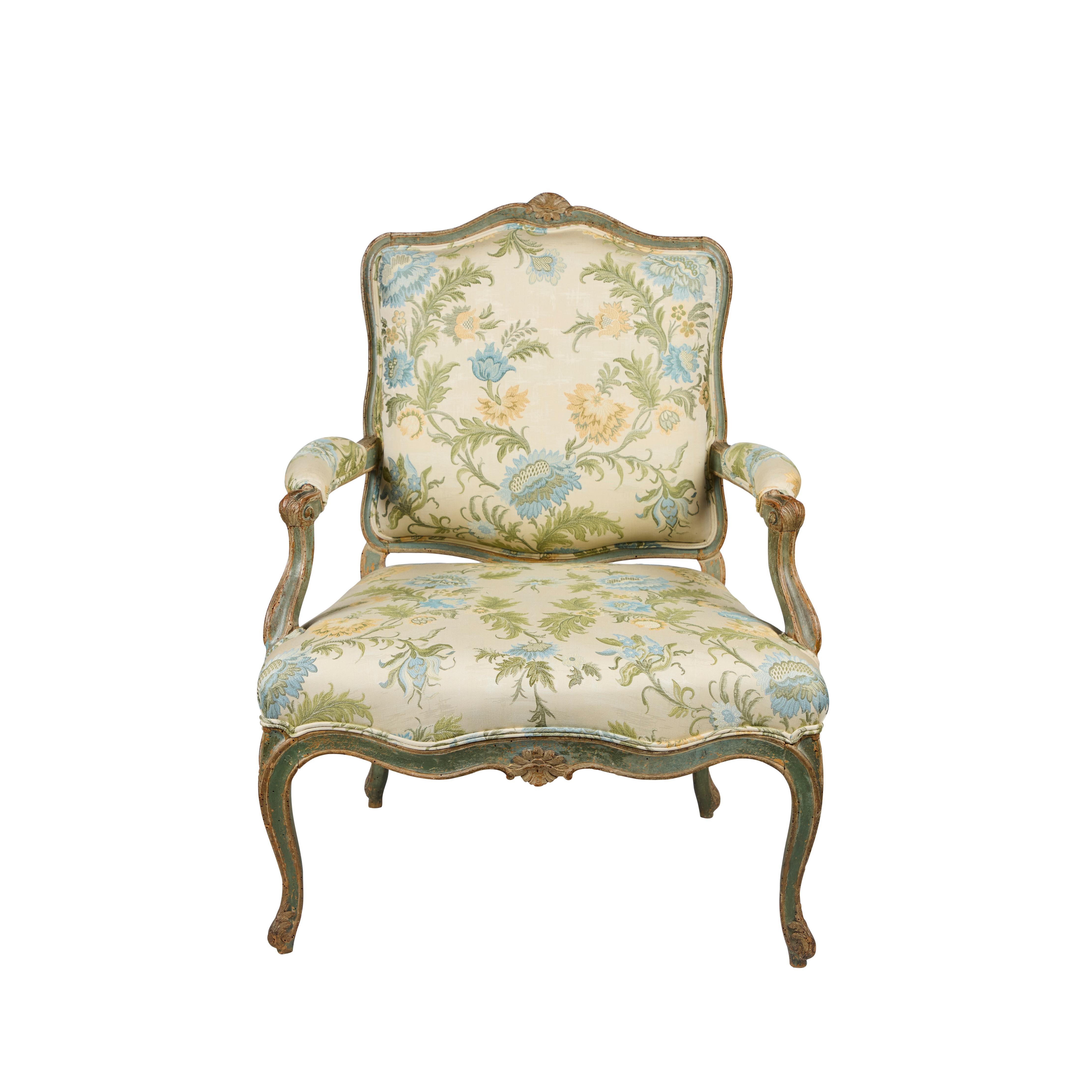A hand-carved Louis XV armchair, hand-painted in a beautiful shade of green, covered in newer Italian, Coraggio fabric with double covered rope trim.