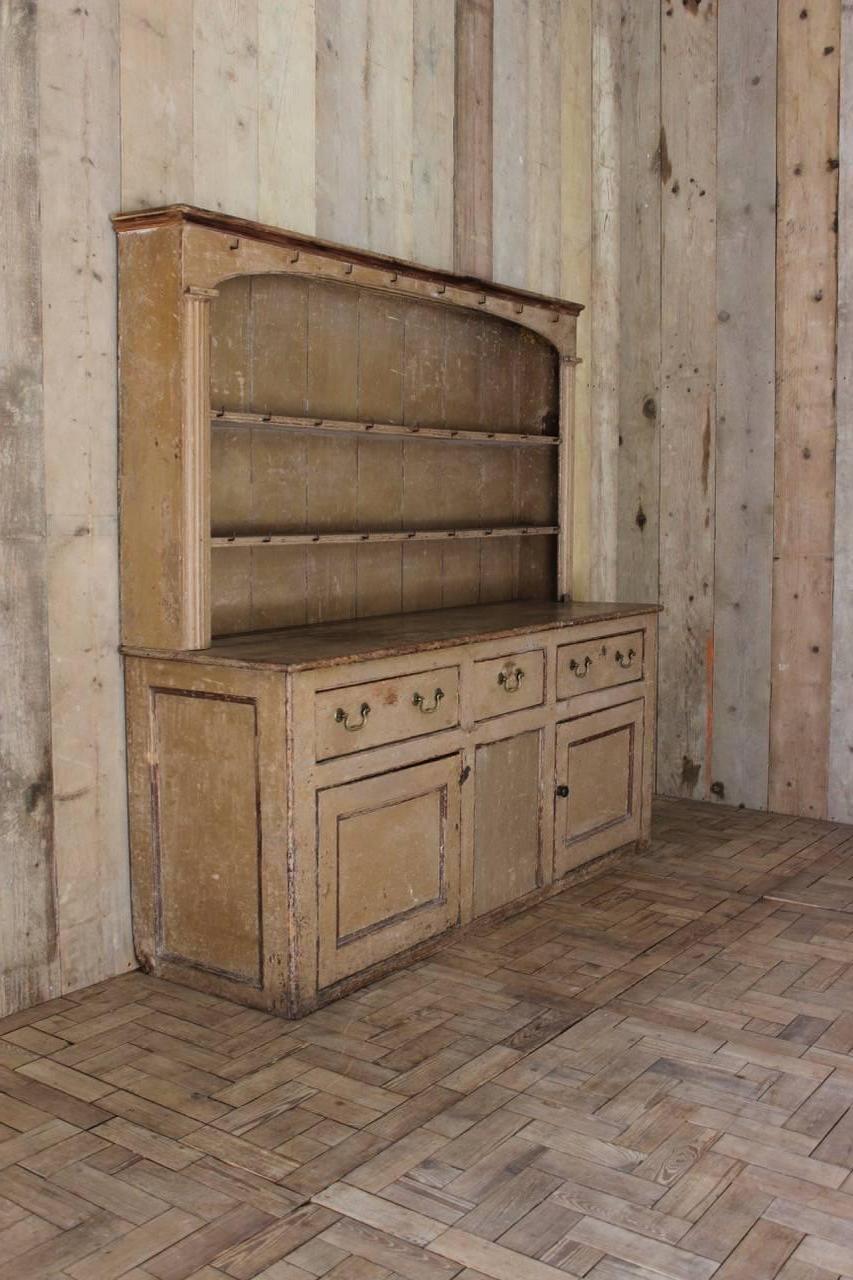 A good late 18th century Georgian English dresser with historic painted finish and architectural plate rack with two shelves, perfect for a kitchen or a cottage dining room.
 