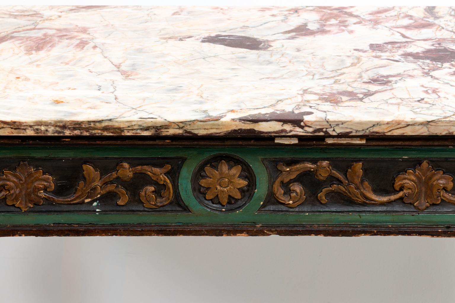 Italian green painted console table with marble top, circa 1780s. The piece rests on four tapered, fluted legs in a carved and old gilded finish with motifs of rosettes and scrolled foliage. Made in Italy. Please note of wear consistent with age