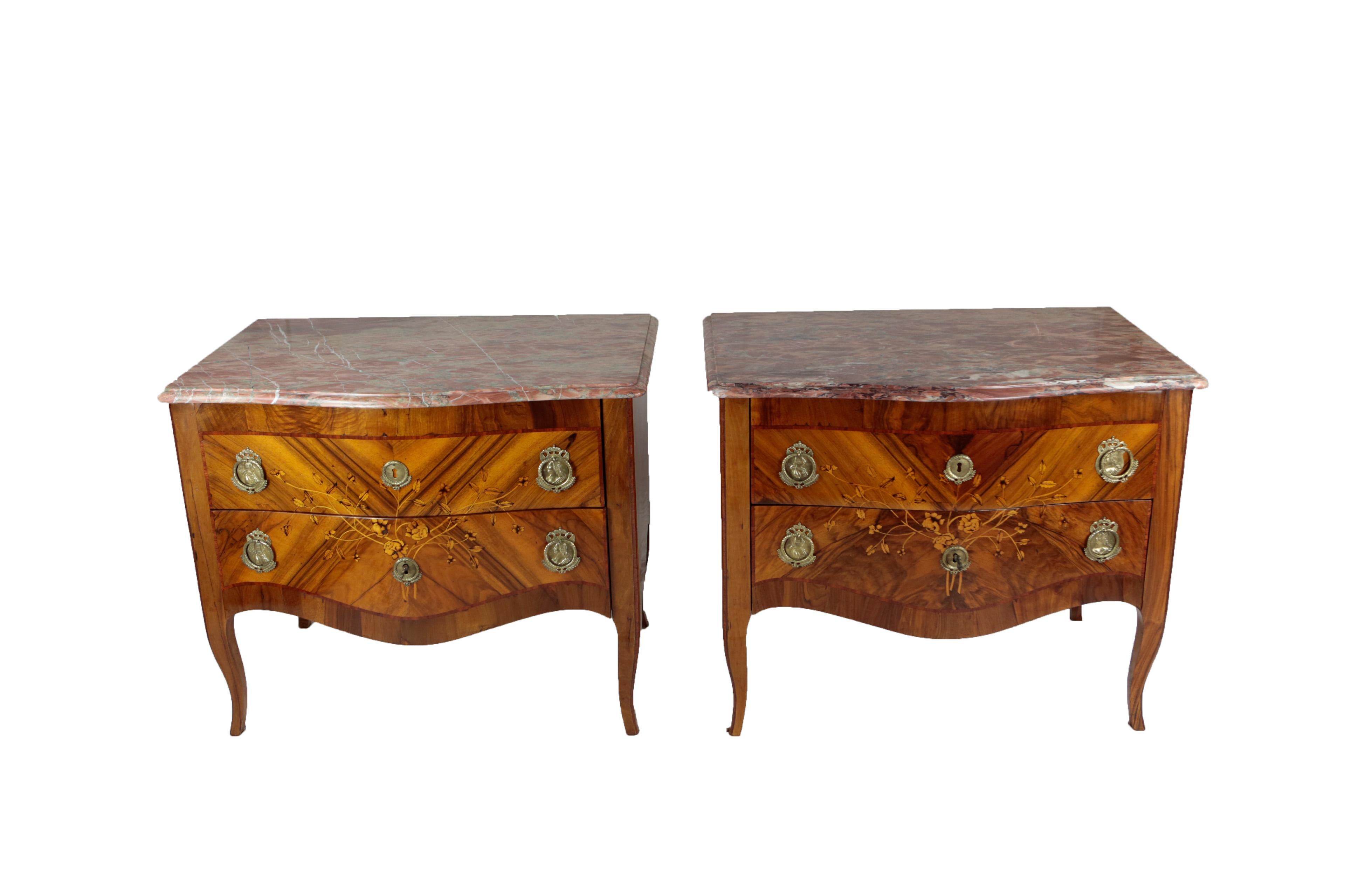 Beautiful pair of chest of drawers from Austria, circa 1760-1770, 2 drawers, nutwood and mahogany veneered, reddish marble top, marquetry with several real woods, floral ornaments, original brass fittings with portraits of Mary Therese of Austria