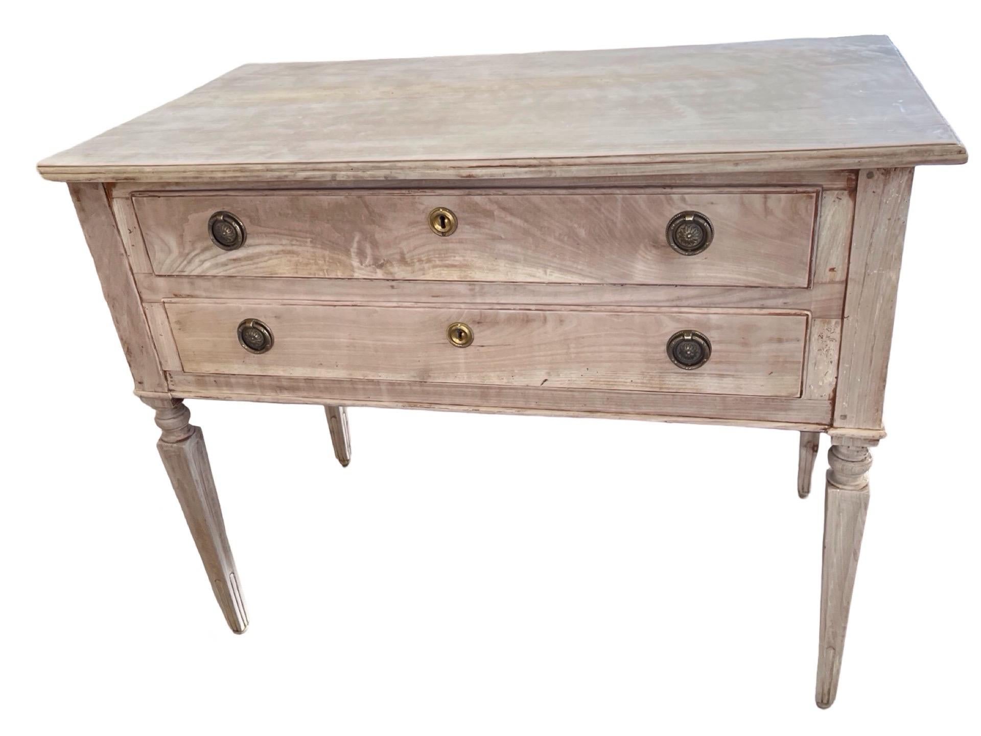 Pair of neoclassical commodes hand-made in Italy in the late 1700s using cherry and pegged construction. The commodes feature two overlay drawers with ogee edges. The tops are made of two boards with ogee edges. Overall the lines are very straight