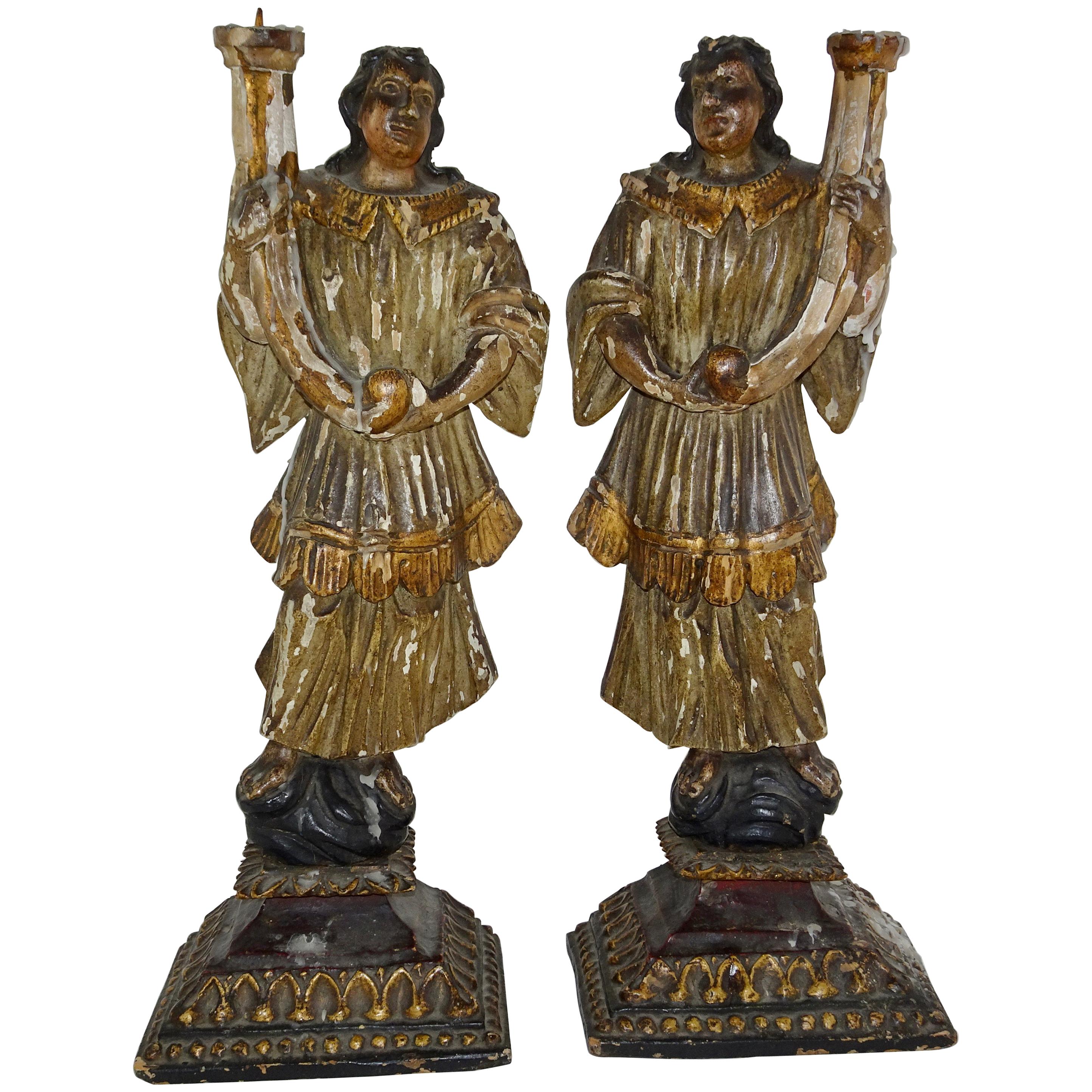 18th Century Pair of Carved Gilt and Paint Italian Figures Holding Candles For Sale