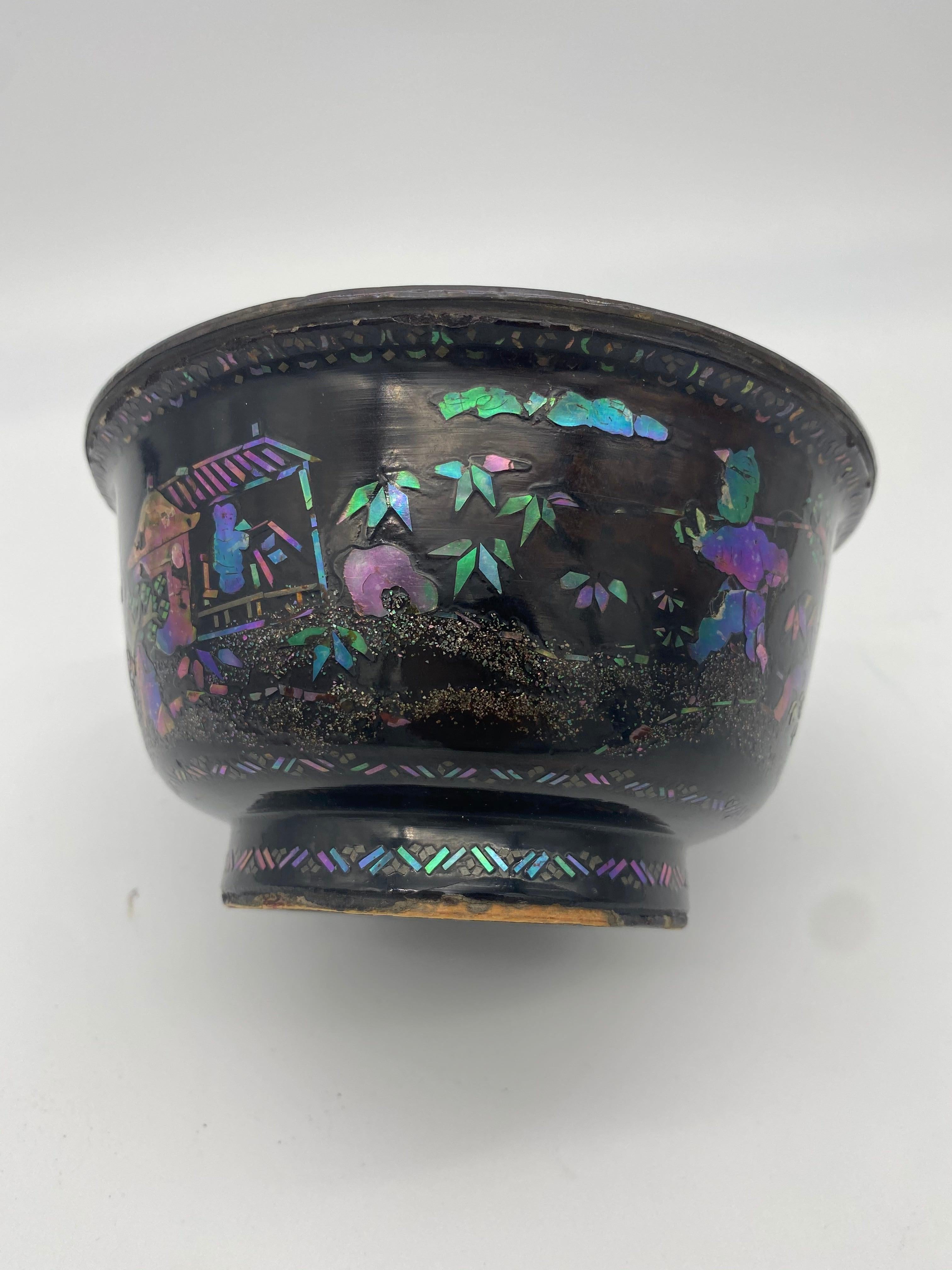 Pair of Chinese silver, lacquer, and mother of pearl big bowls from the 18th century. The faces each of a thin sheet of distressed silver over a body of black lacquered wood with mother of pearl inlays representing traditional style Chinese