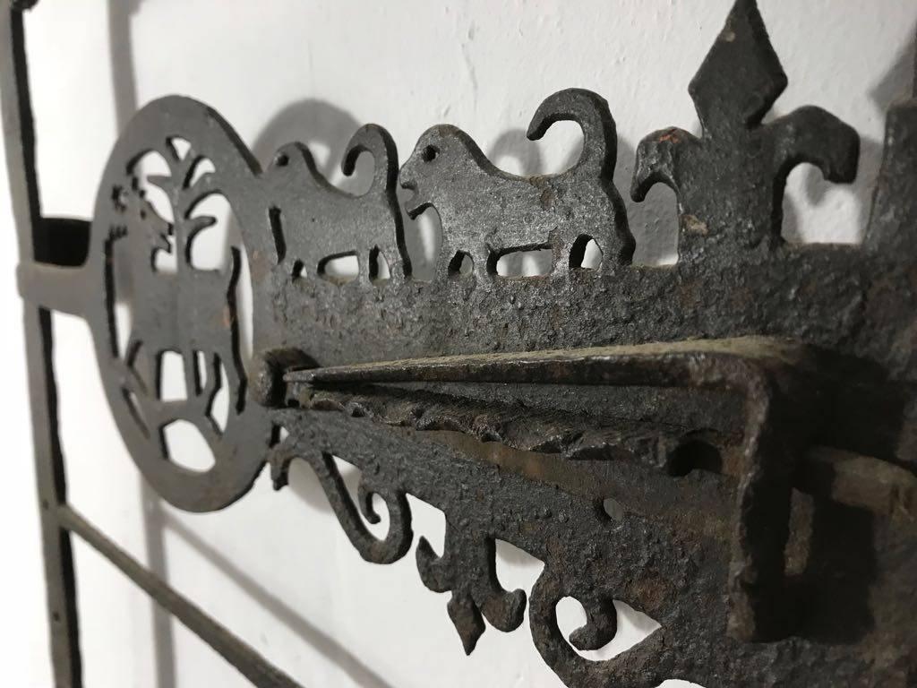 Extremely rare pair of Folk Art wrought iron window shutters in excellent condition. There are two shutters, the larger one measures 38cm deep x 5cm wide x 112cm high; the smaller one measures 38 cm deep x 5cm wide x 94cm high. The large shutter