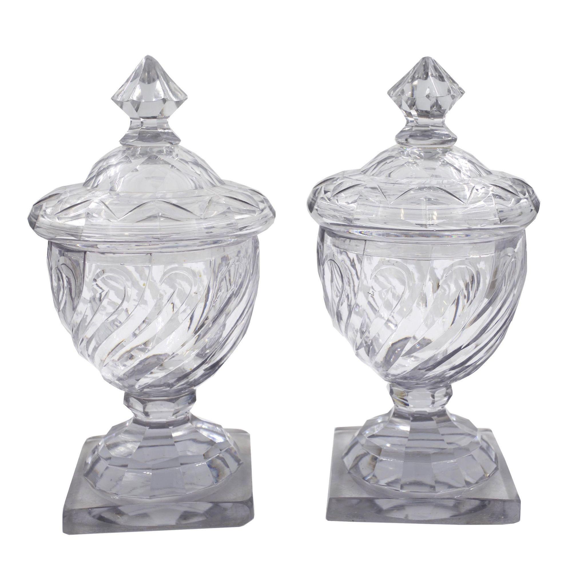 PAIR OF GEORGIAN SWIRLED CUT GLASS URNS WITH DOMED LIDS
Circa late 18th century, probably English
Item # C104029

A fine pair of late 18th century Georgian cut glass urns with domed lids, they exhibit a marvelous swirled design in the faceted