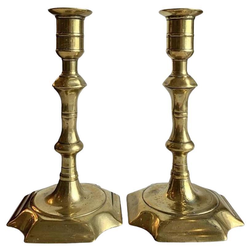 18th Century Pair of English Queen Anne Brass Candlesticks For Sale