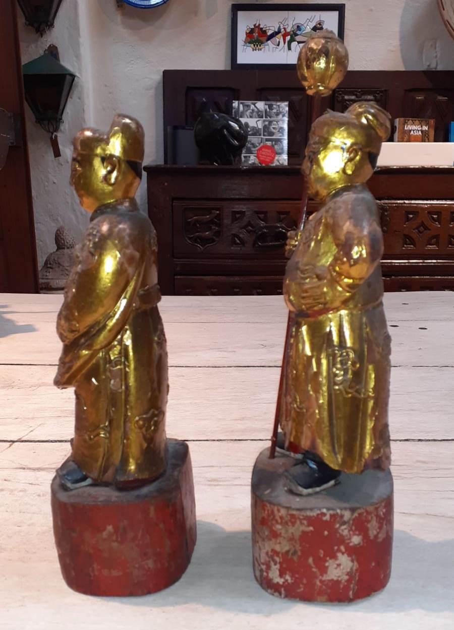 18th century pair of gilded hand carved wooden Buddhist monks.