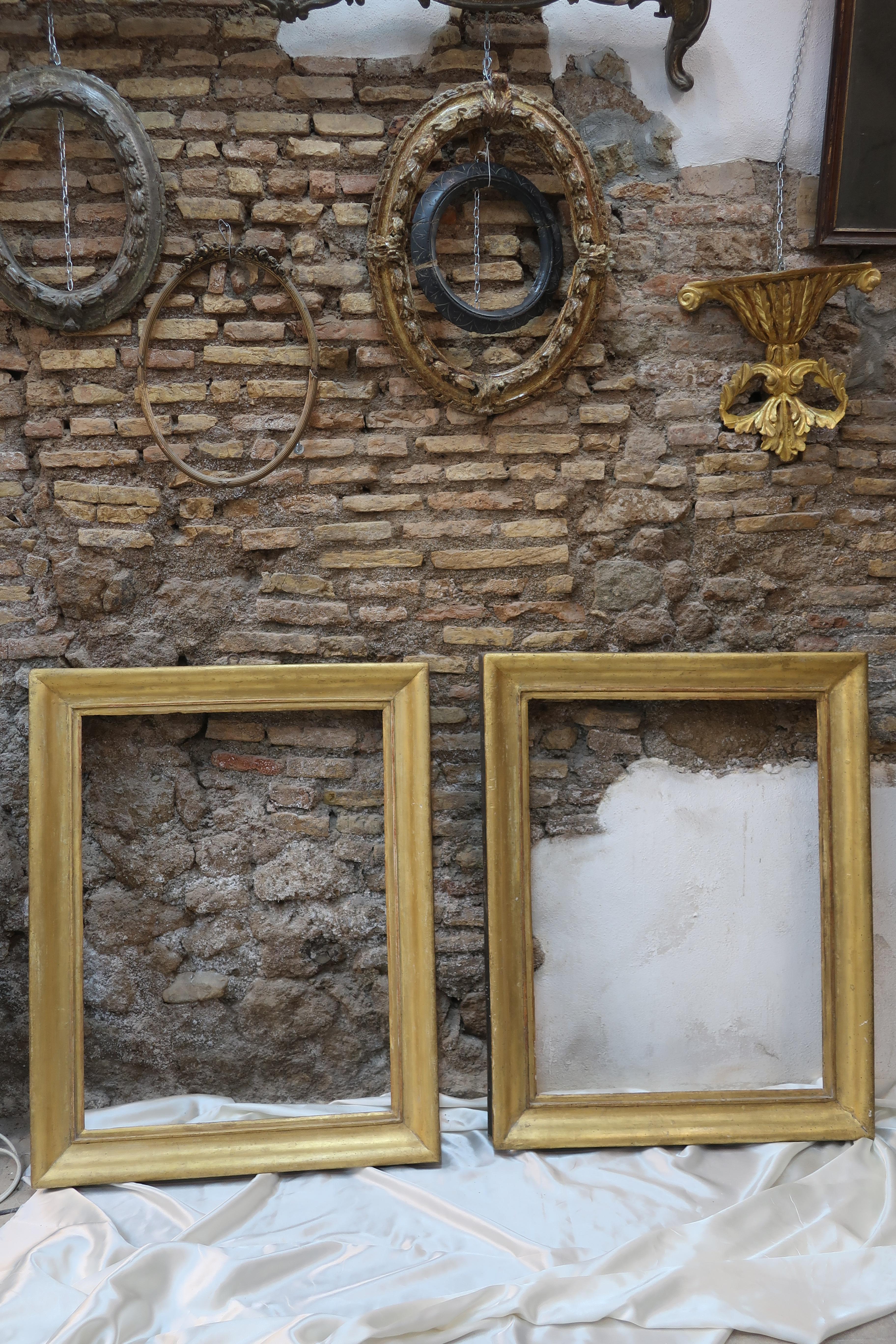 This pair of 18th century frames have never been restored or re-adjusted. 
The simple lines of these frames are justified by the need of producing frames that would enhance the beauty and power of the paintings that were hosted in its interior.