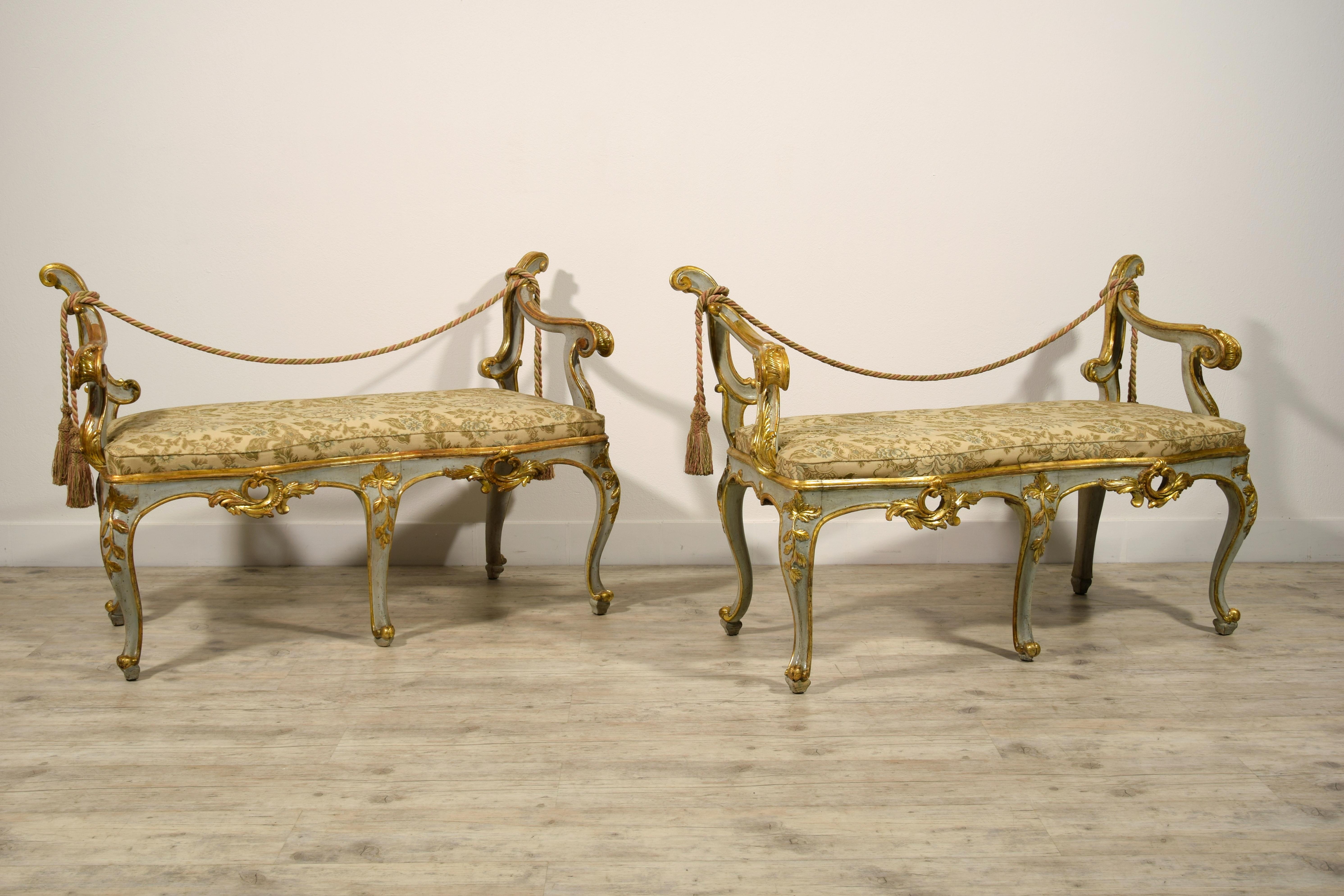 18th century, pair of Italian Baroque lacquered and gilt wood benches 

This particular pair of baroque benches was made in Rome, Italy, in the second half of the 18th century.
Their wooden structure is entirely sculpted, lacquered and gilded in