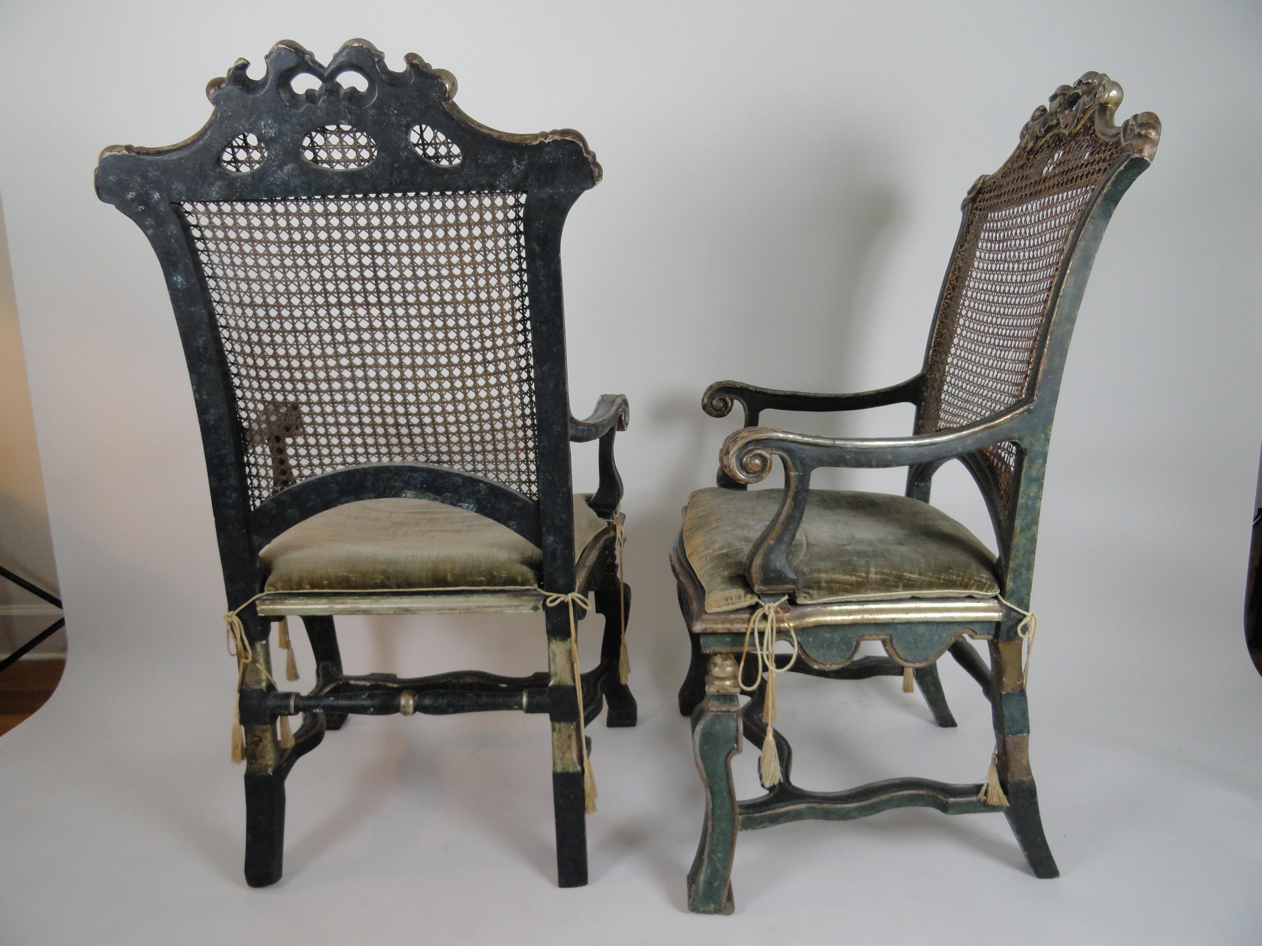 The rectangular caned back with molded frame and shaped projecting crest rail with centred carved cresting of facing heraldic eagles, joined to framed caned seat with pelmet shaped apron by scrolling molded arms on vasiform supports, raised on