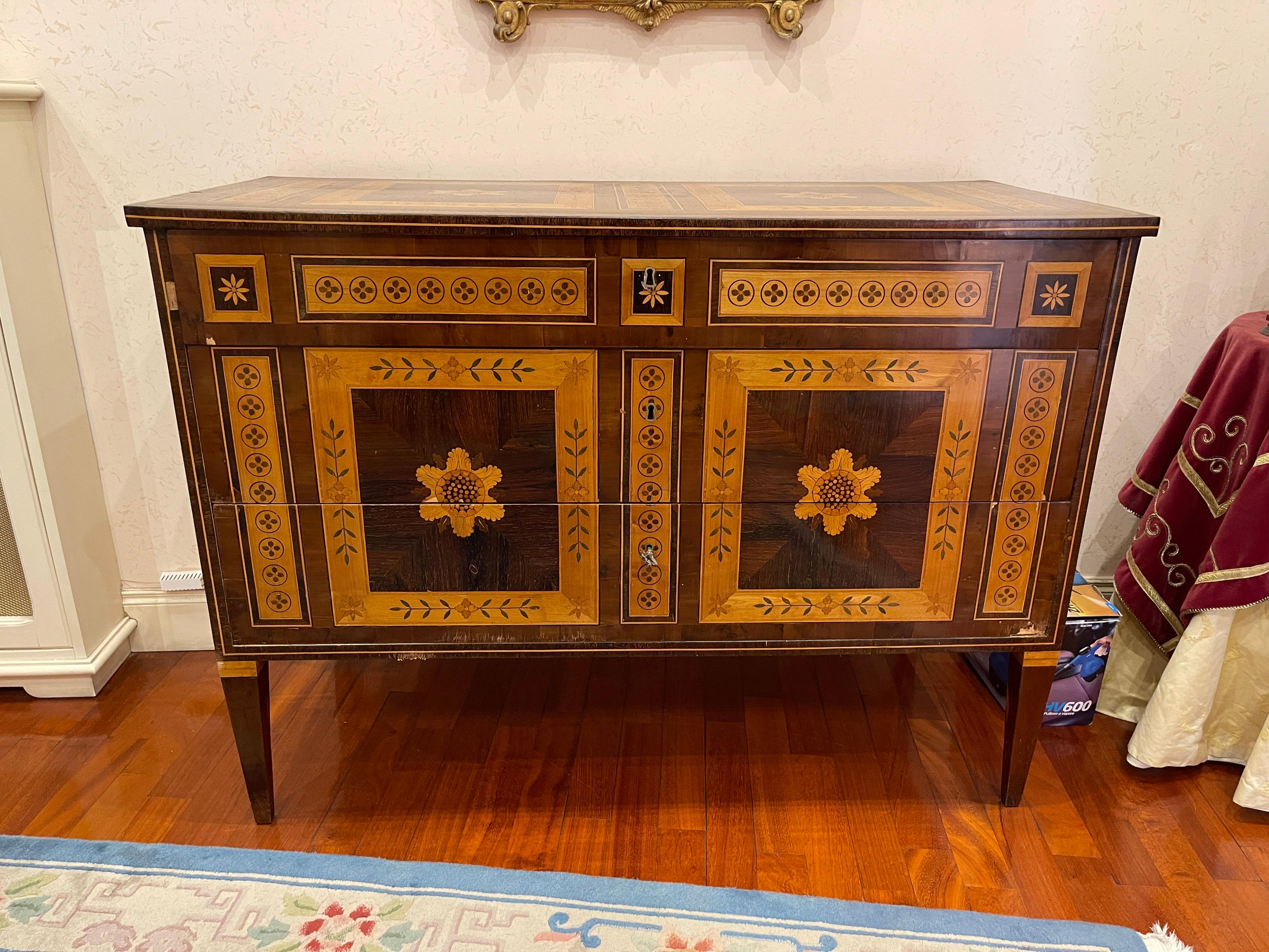 Pair of Fantastic Italian Commodes, Emilian area, Louis XVI period, 1780-90 approx, of remarkable workmanship The inlay that adorns the two dressers, with floral and geometric motifs, the woods are of great quality, walnut, rosewood and wood fruit