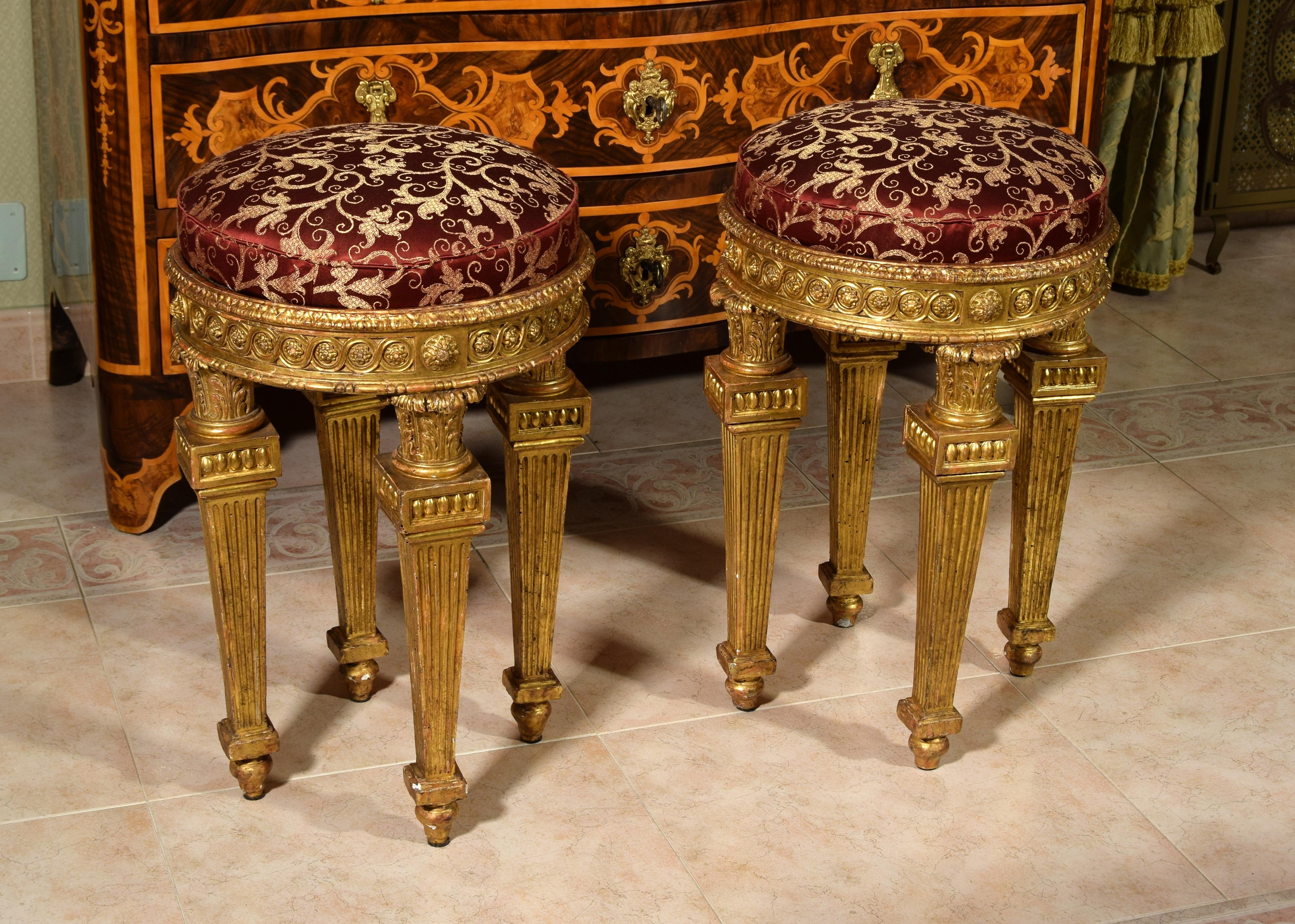 18th century, pair of Italian neoclassical carved giltwood stools

The fine pair of neoclassical stools, made in Sicily (Italy) in the second half of the 18th century, consists of a wooden structure finely carved and gilded. The seat, lined in