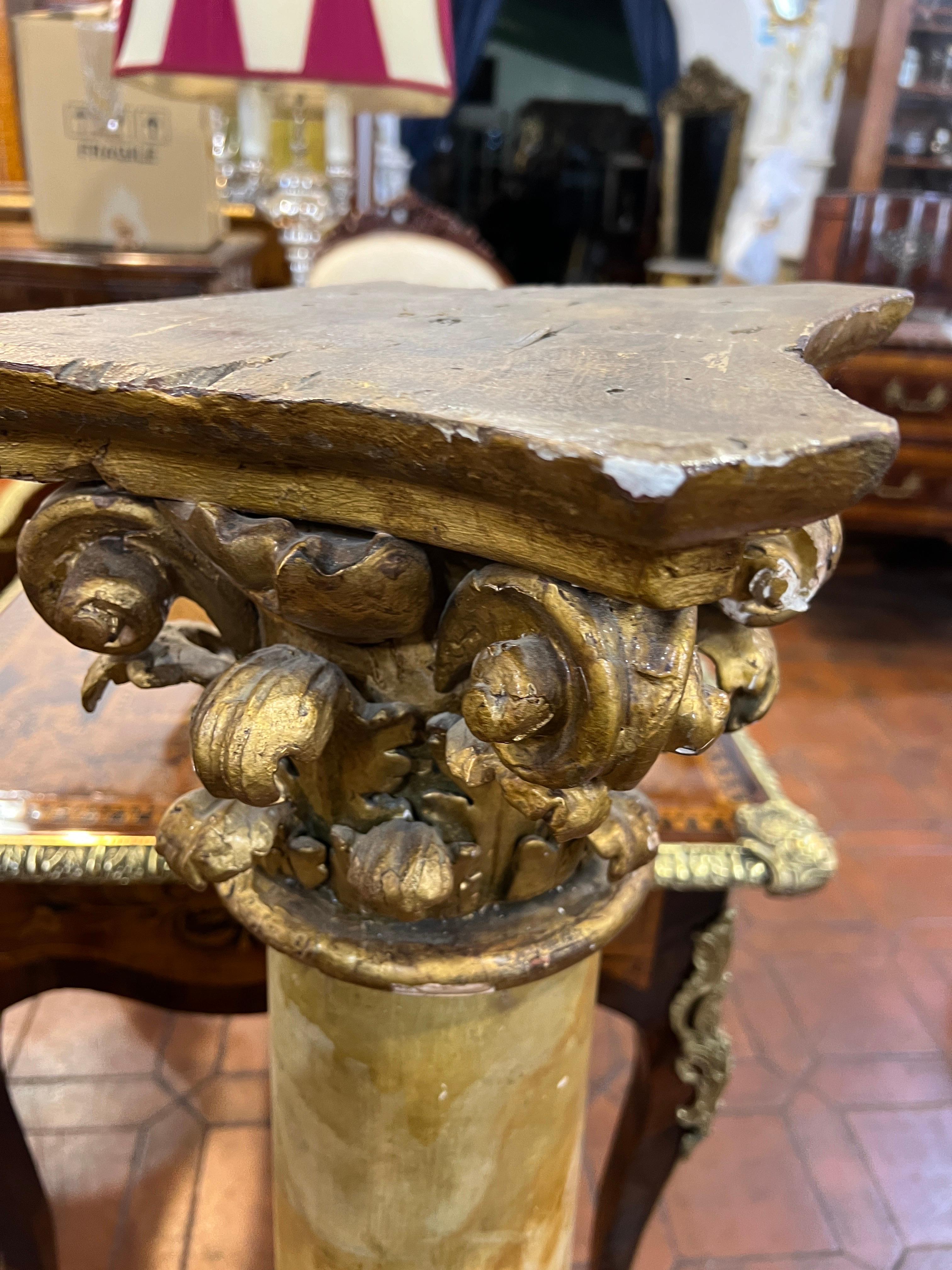 Pair of French columns , period straddling Louis XV and Louis XVI , worked in faux marble and with finely carved Corinthian capital worked in gold leaf. Excellent as vase holders or busts. Small in size easily placed in various places in the