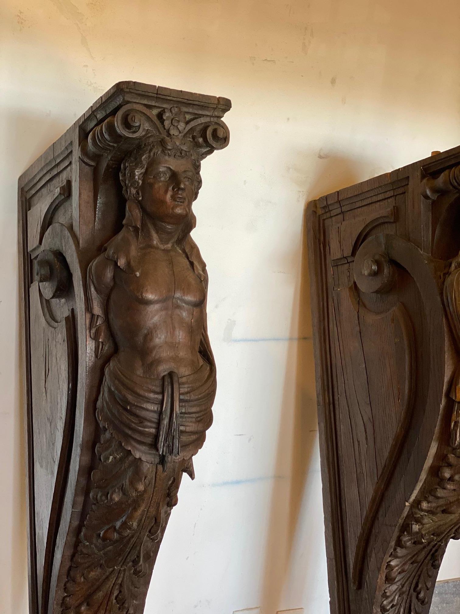 This pair of caryatid are made of oak and date back to the 1700s, France.

Measurements: 19” D x 7” W x 55” H.