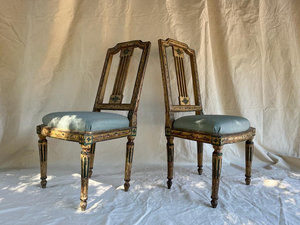 Pair of painted wooden chairs. Plant motifs. upholstered in horsehair and lined with blue silk.
 