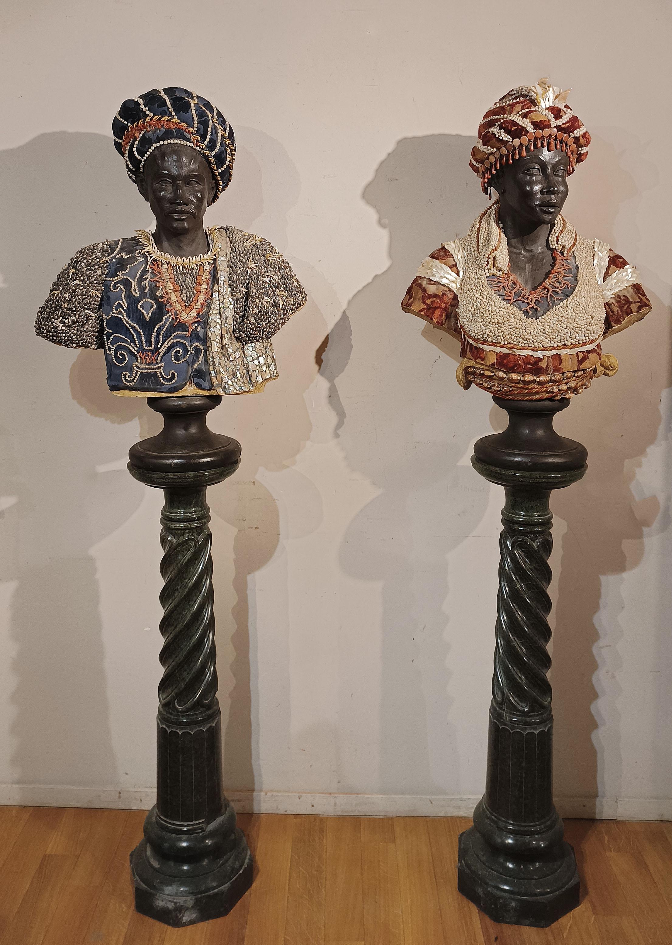 Unique and elegant pair of ebonized carved wooden sculptures depicting two Sicilian 