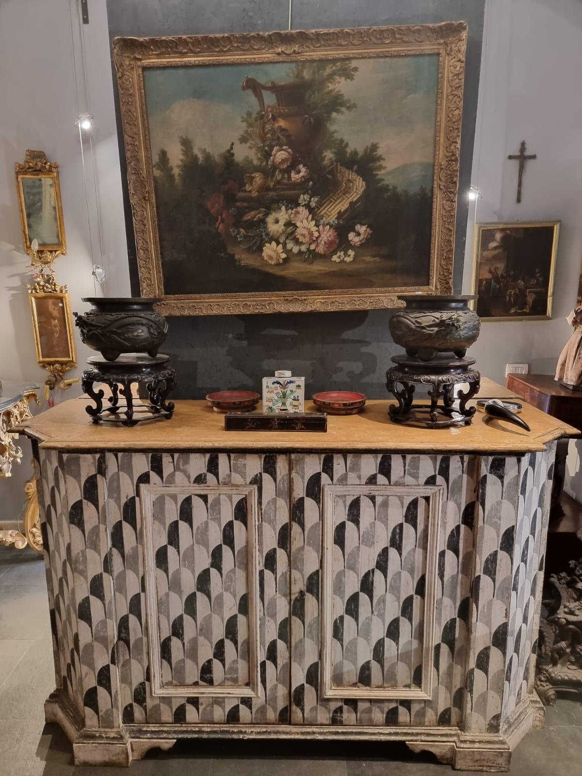 Beautiful pair of sideboards in mixed woods from 18th century.
The furniture itself is original but the painting is not original. The particular is that these sideboards have an internal drawer. 
Moreover thanks to their shape it gives a sense of