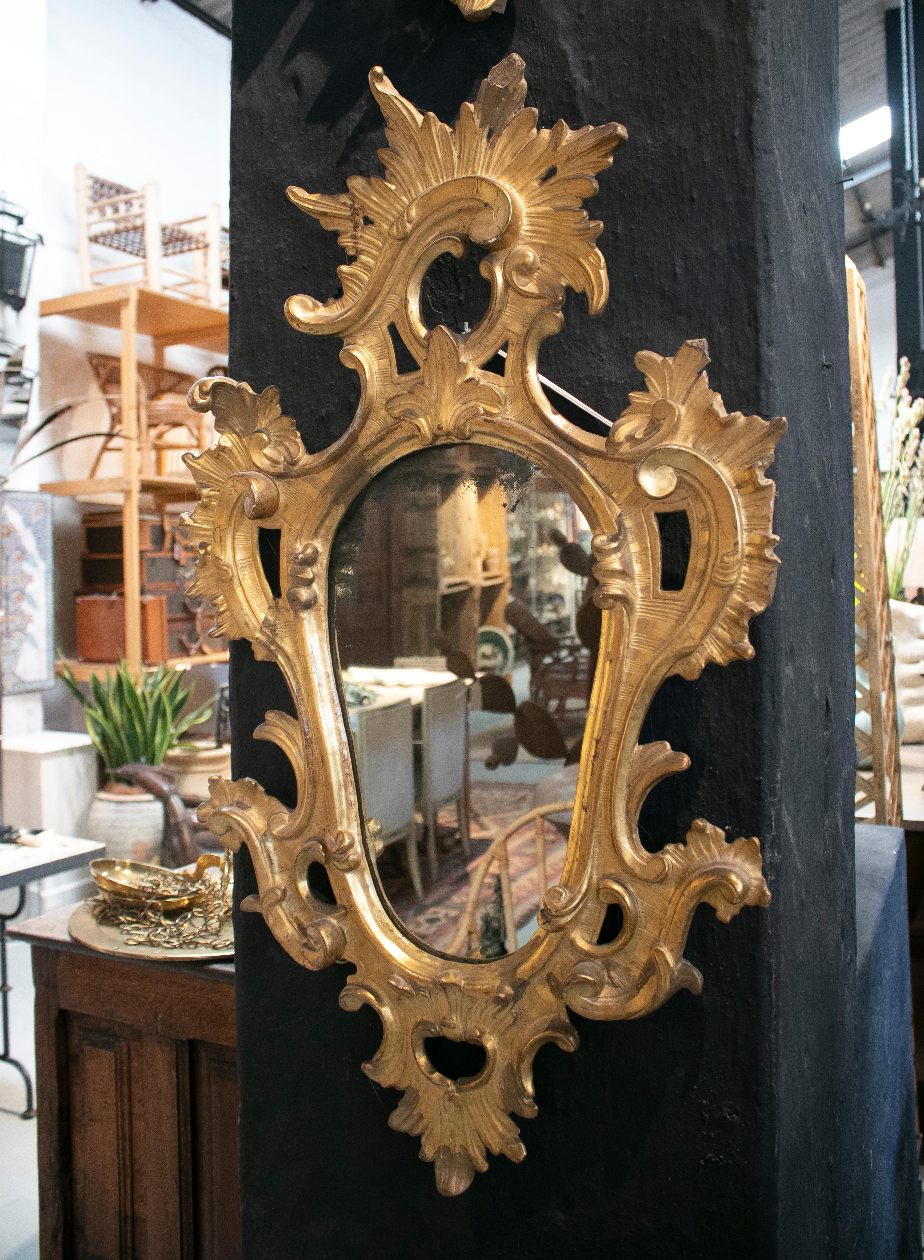 18th century pair of Spanish Isabelline gold gildwood mirrors.