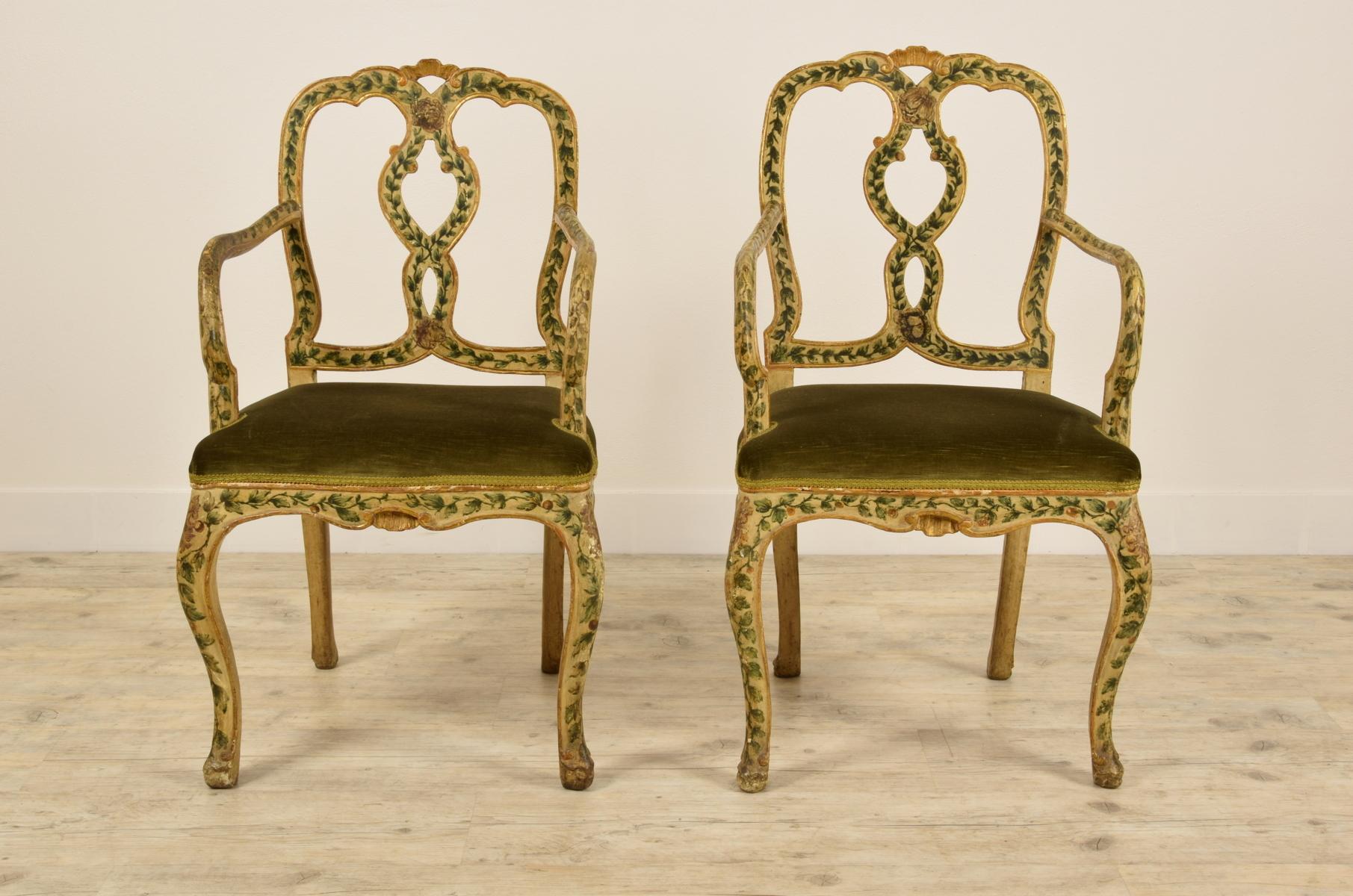 Fine pair of Venetian armchairs in polychrome lacquered wood with vegetal motifs and golden details.
Venice, Italy, mid-18th century 

The lovely pair of armchairs is made in Venice in the middle of the 18th century, Louis XV. The wood,