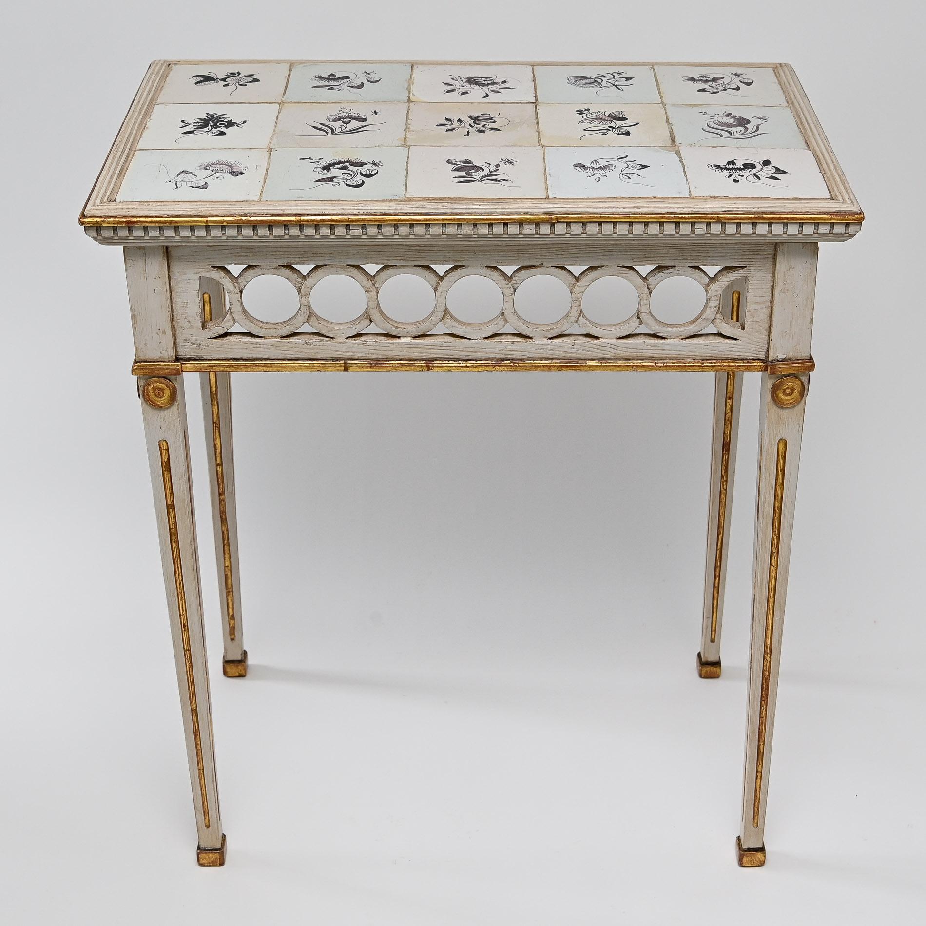 An unusual and rare pair of mounted console tables.
Beautiful special setting with the original gilding. The ceramic tiles with expressive depictions of flowers are also original and from the 18th century. The flower painting is done in manganese