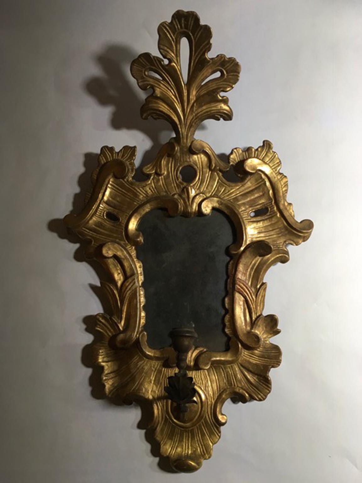 Italy late 18th century pair of sconces with original mercury mirrors in golden wooden frames in Louis XV Style

It is not easy to find these pair of sconces with their own intact original mercury mirrors.
The handmade pinewood frames have some less