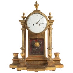 18th Century Pendulum in Golden Wood in the Representation Ancient Amphitheater