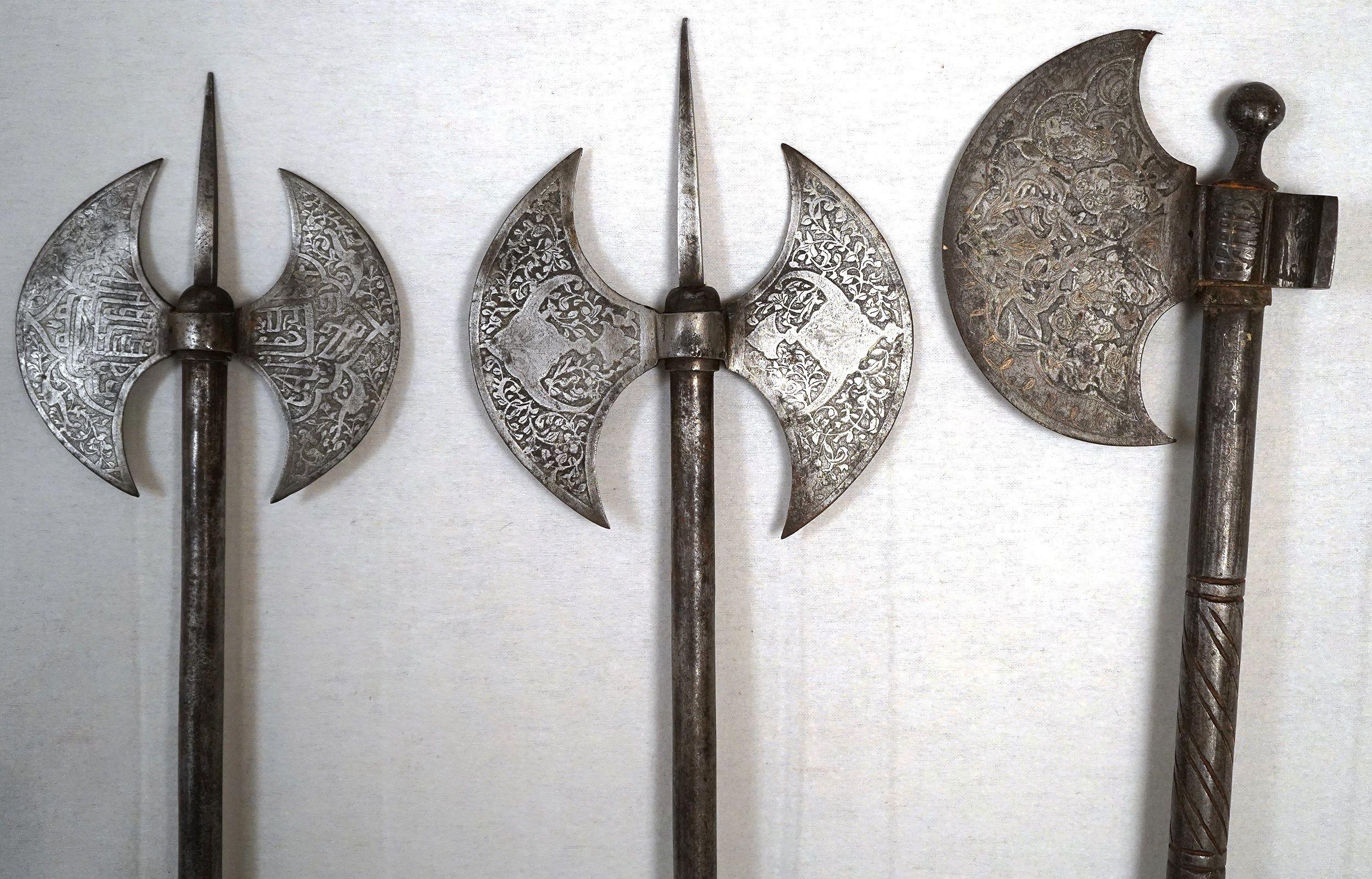 18th century Persian engraves axes, including two double-bladed and one single blade axe. $750 for each axe or $2,250 for all three. Shield sold separately. Greatest axe length 25 inches (63.5 cm). Double-edged axe width: 6.5 inches. Single-sided