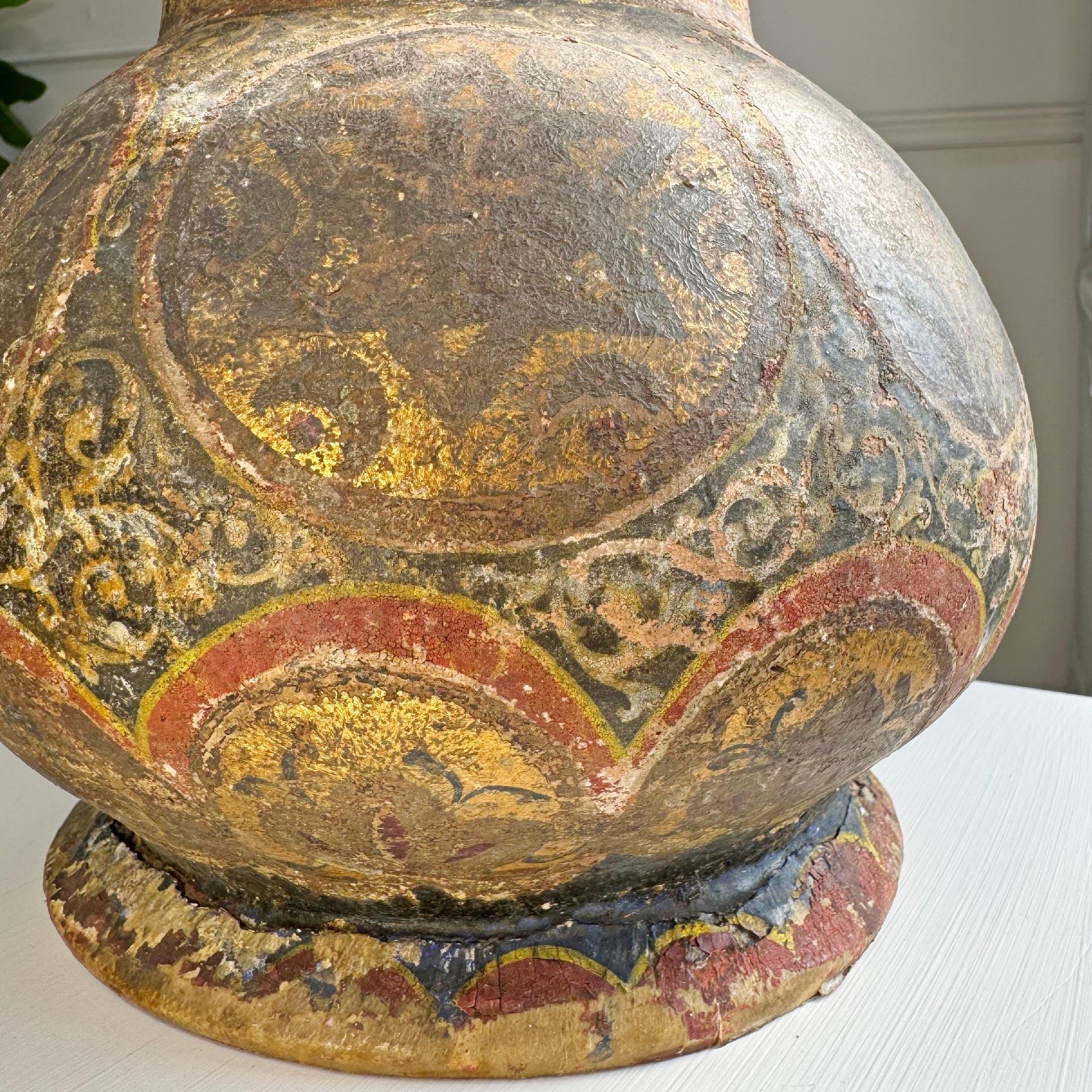 Stunning 18th century Persian vase, hand crafted in terracotta and adorned with incredible Islamic and Persian decoration in golds and polychrome colours. Unusually it has an open neck and base, small areas of cracking to the terracotta under the