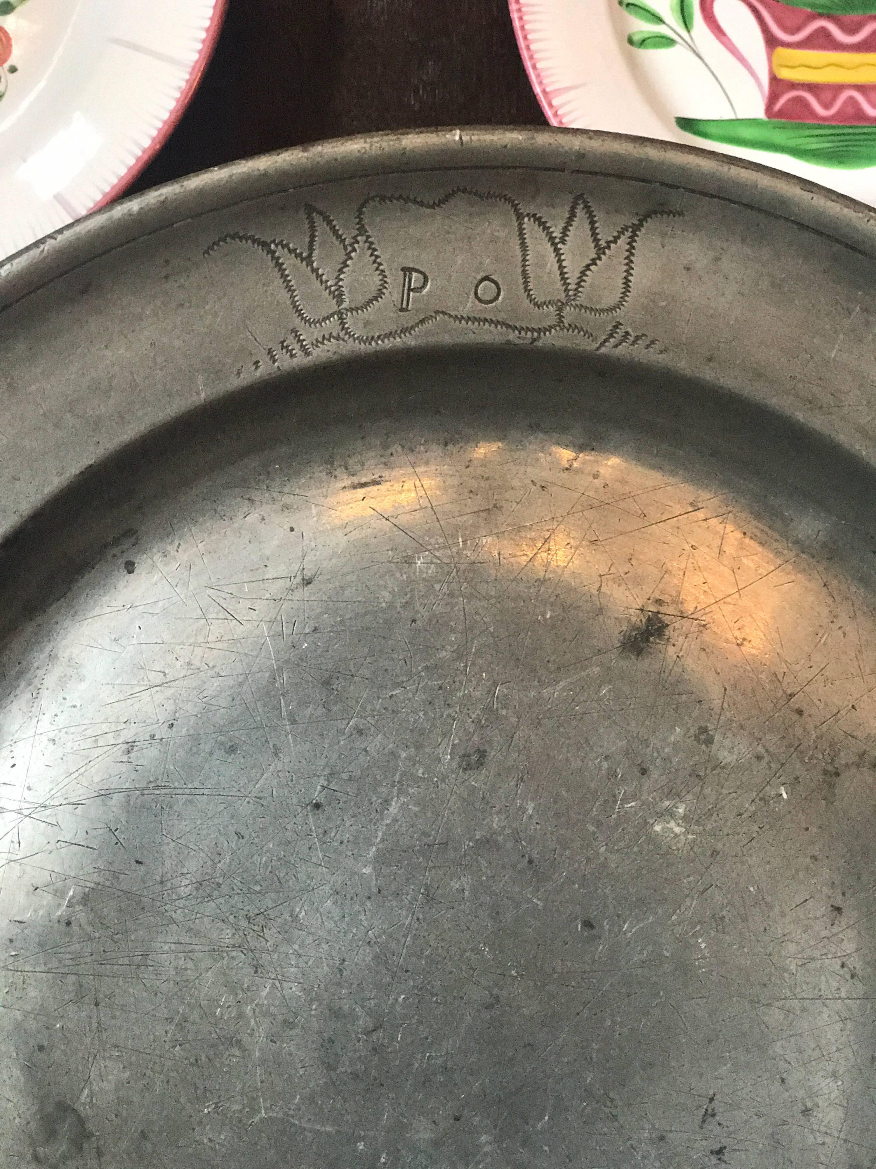 Beautiful French antique pewter plate from the 1700s, featuring the initials P.O. on the front and the hallmark stamped three times on the back. 
