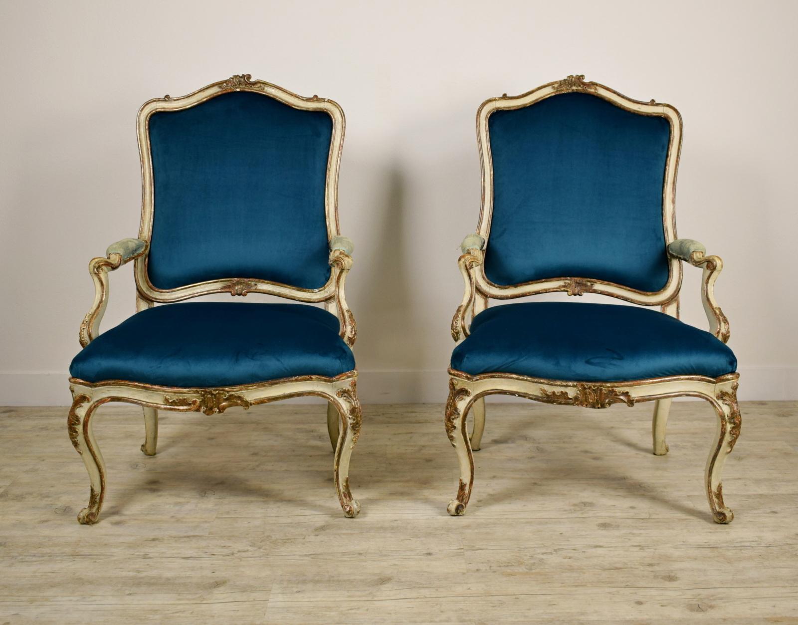 18th Century, Pair of Italian Lacquered Silver Carved Wood Armchairs 

This elegant pair of armchairs, made in the north of Italy (Piedmont) in the 18th century, has a finely carved wood structure, lacquered and silver plated.

These large Baroque