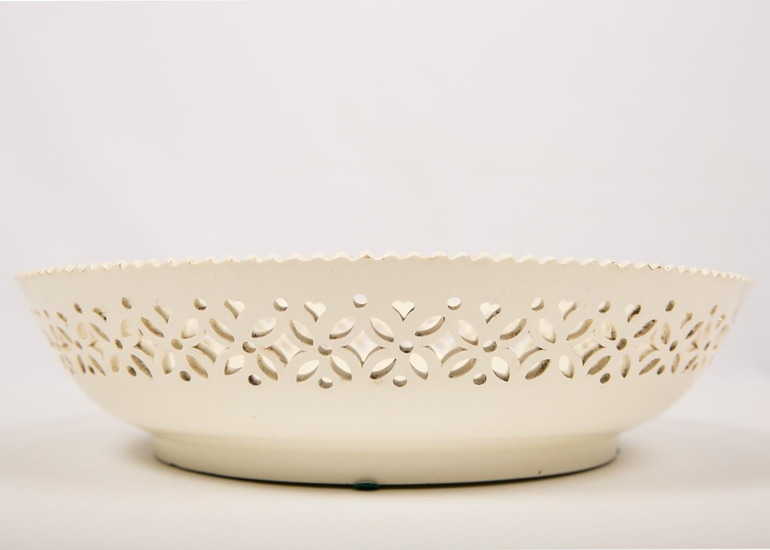 WHY WE LOVE IT: We love 18th century creamware
We are pleased to offer this large 18th century creamware bowl made in England circa 1780 with a band of crisp piercings in the shape of diamonds, heart shapes, and dots. The edge is evenly scalloped.